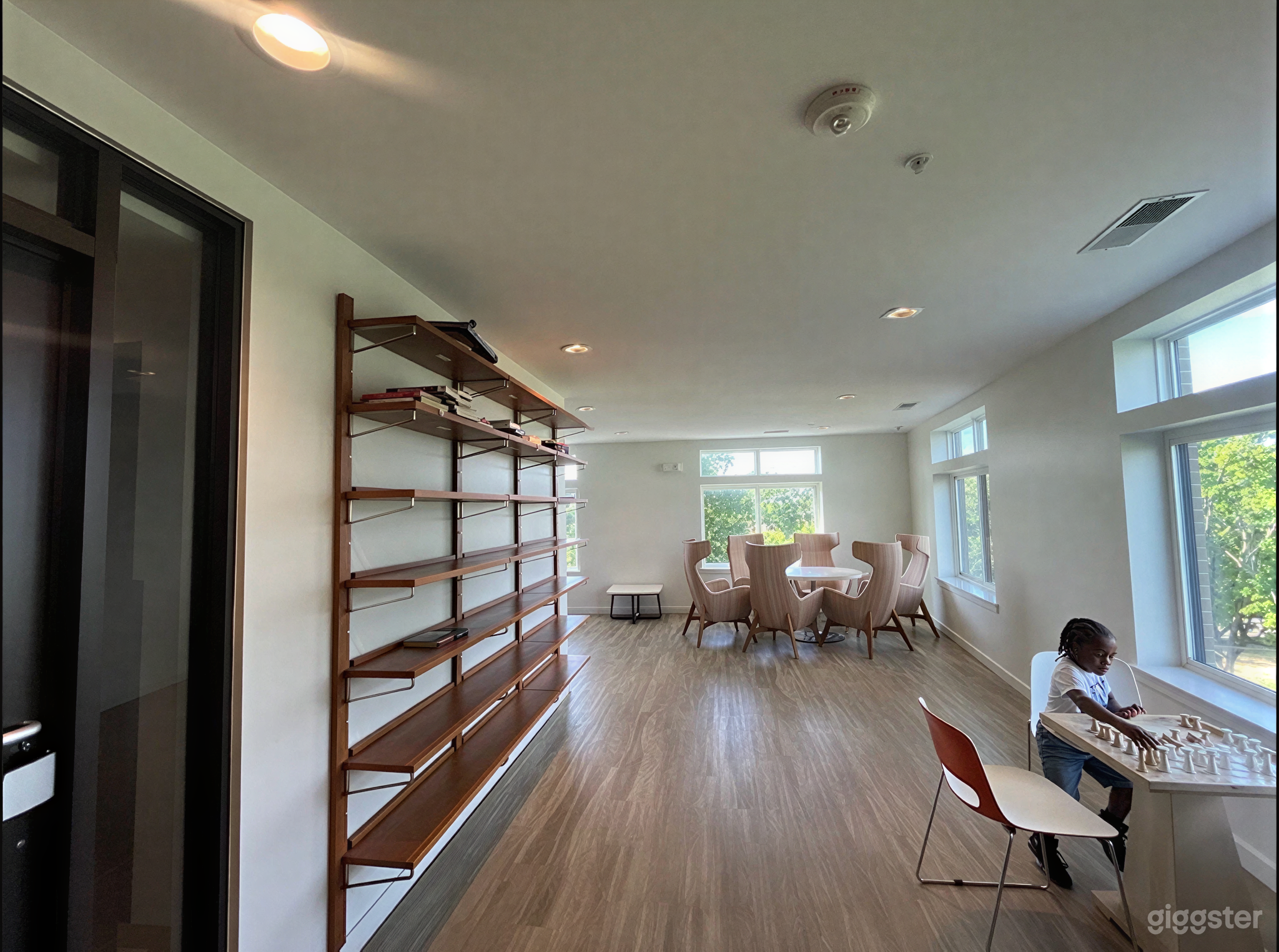Modern Sunlit Meeting Room with High-Back Lounge Seating Photo 1