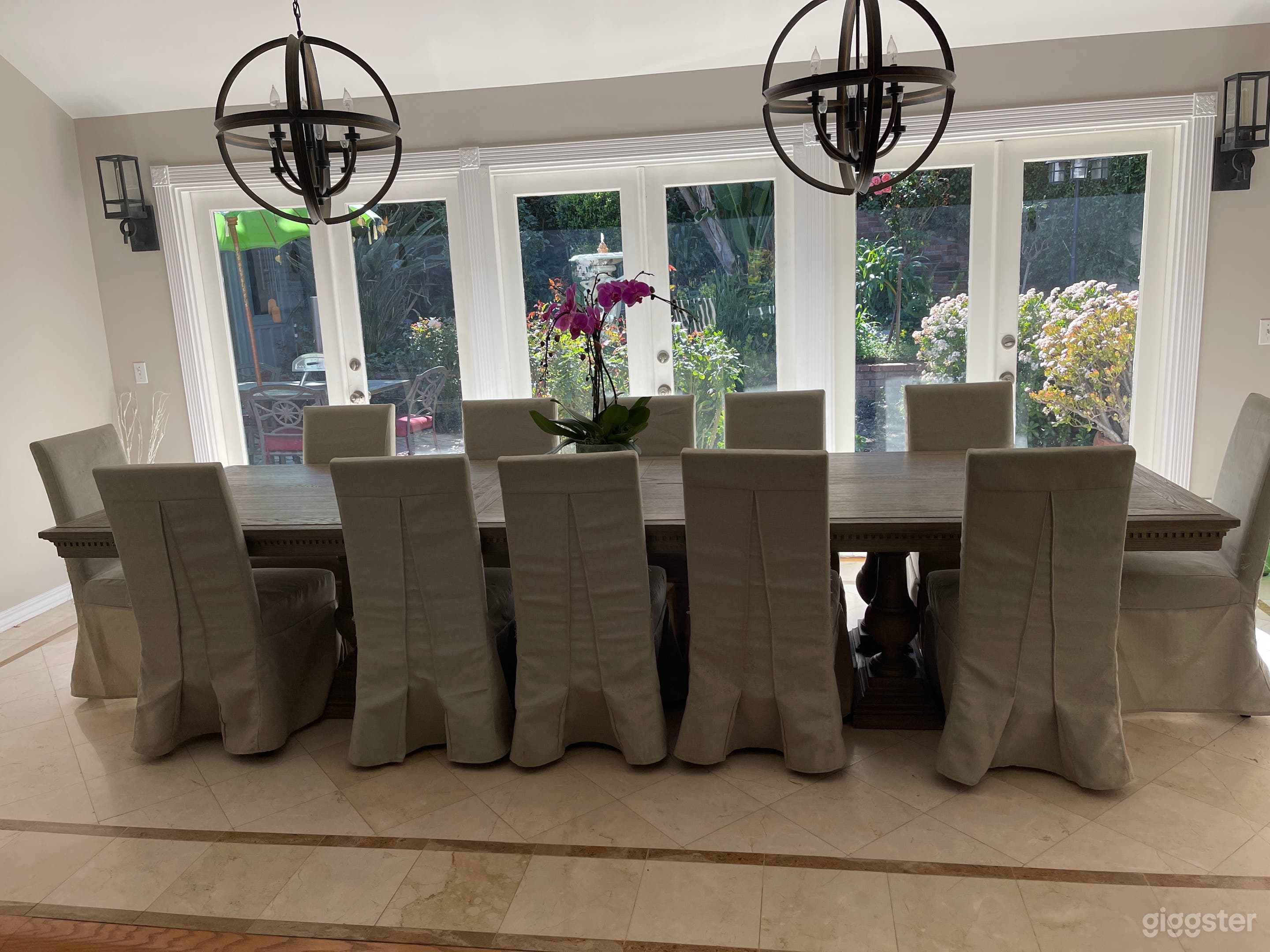 Formal dining room looking out to courtyard with fountain