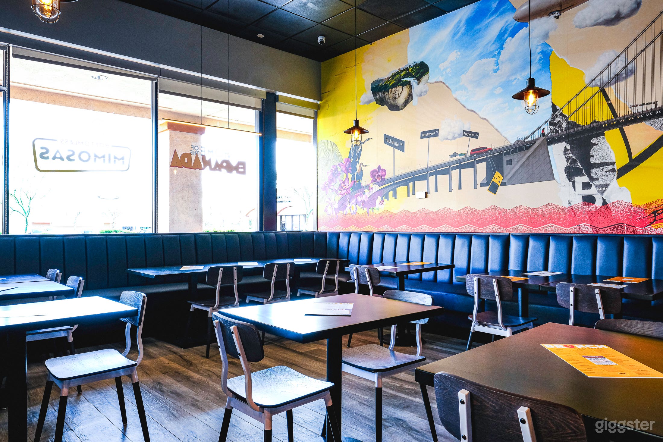 Booth seating with a lot of natural light.