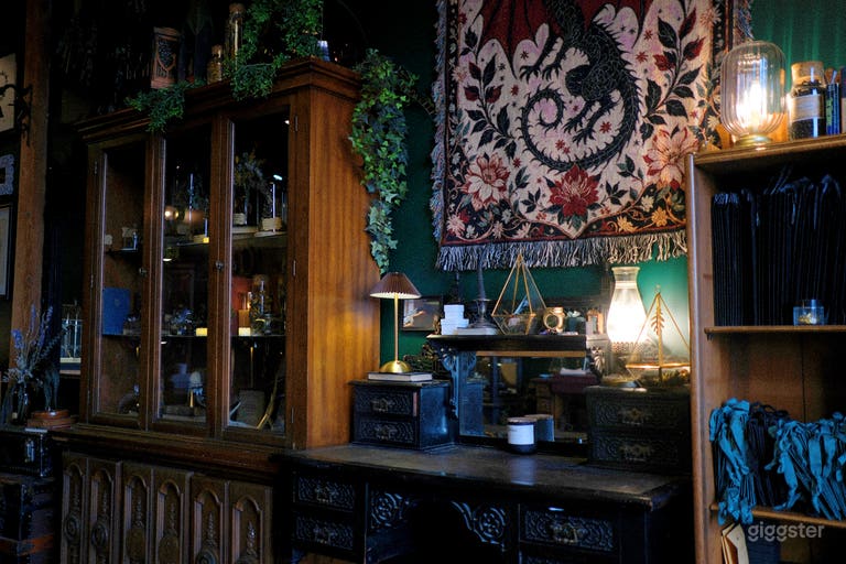  antique black vanity with dragon tapestry with view of the curio cabinet 