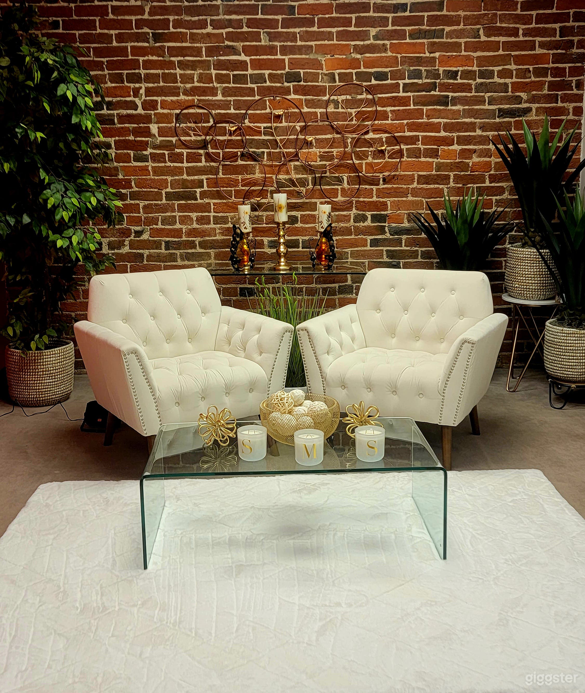 There are multiple sets to be choose from. There is only 1 set of your choice per booking. To use multiple set in your scheduled time you must pay for add on of the extra sets. Set offer 2 chairs, plants and or a clear glass table. will do minor moving for