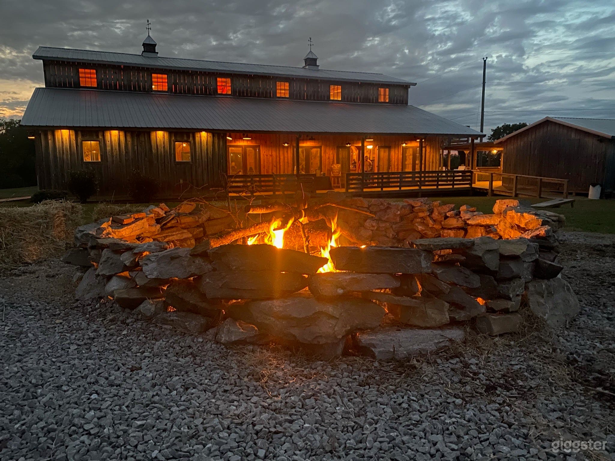 Outdoor lighting, seating and a firepit add ambience in the evenings.