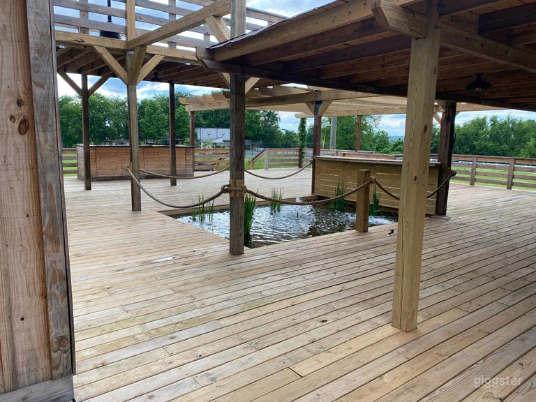  Extended patio attached to the barn, includes a koi pond. 