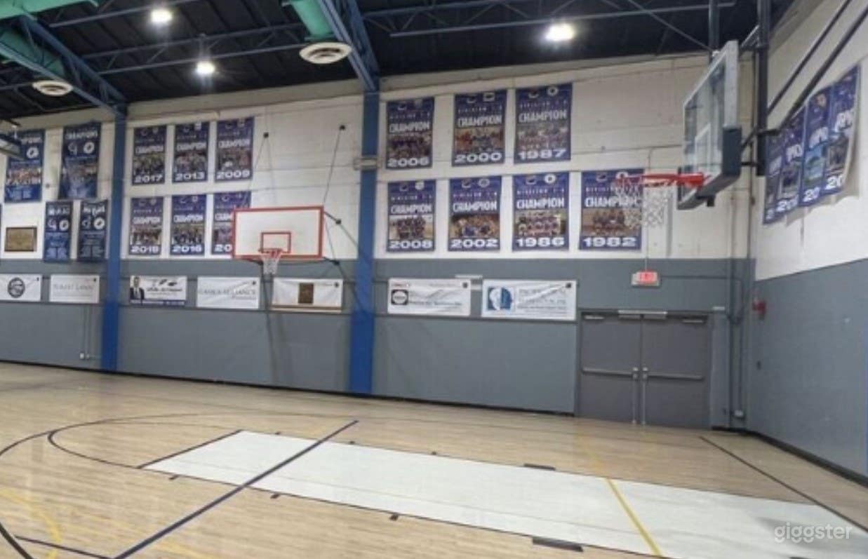 Spacious Indoor School Basketball Court Photo 1