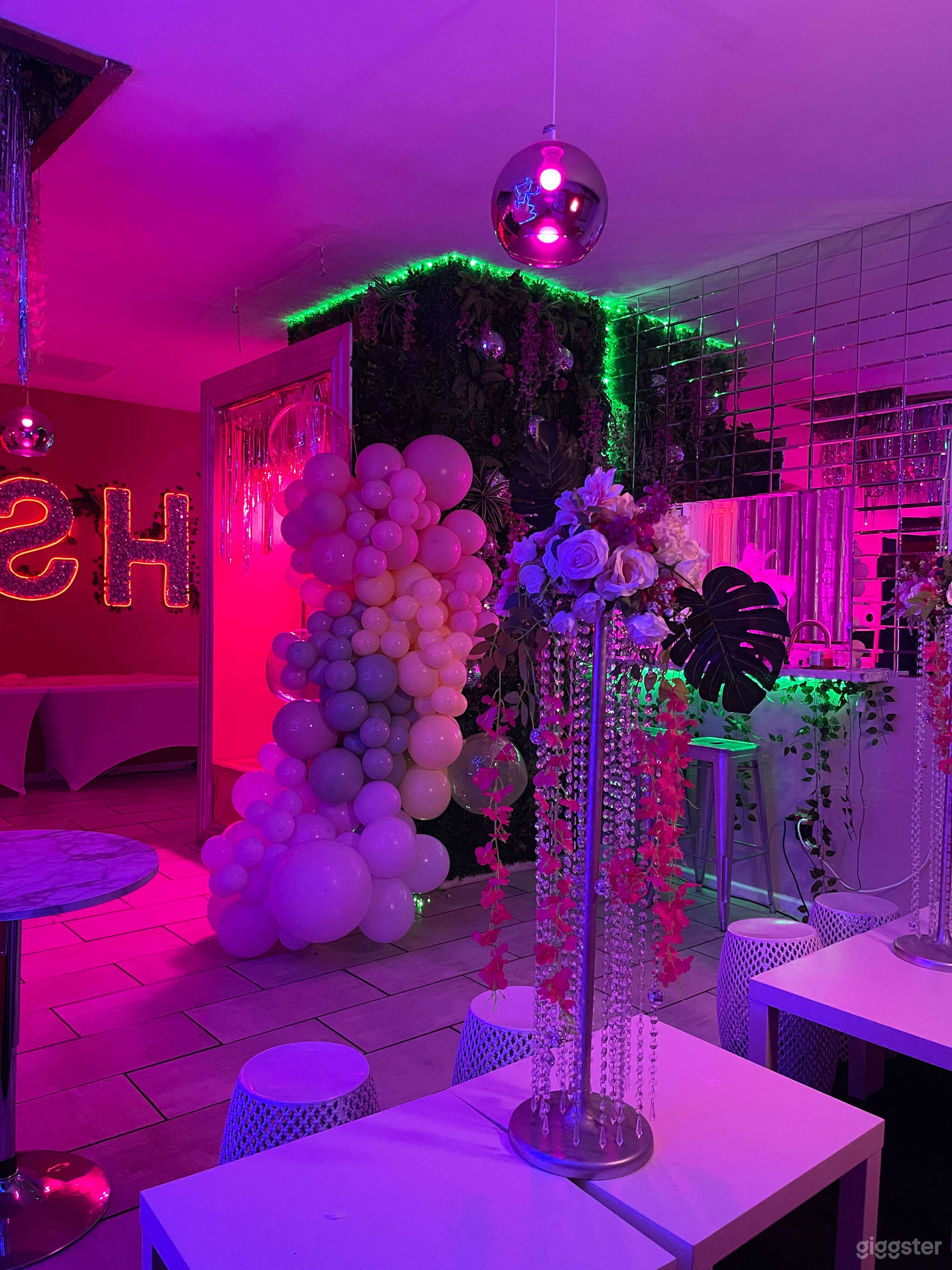 Customized balloon garland around photo booth available as an add-on to elevate your event photos at Hush Events