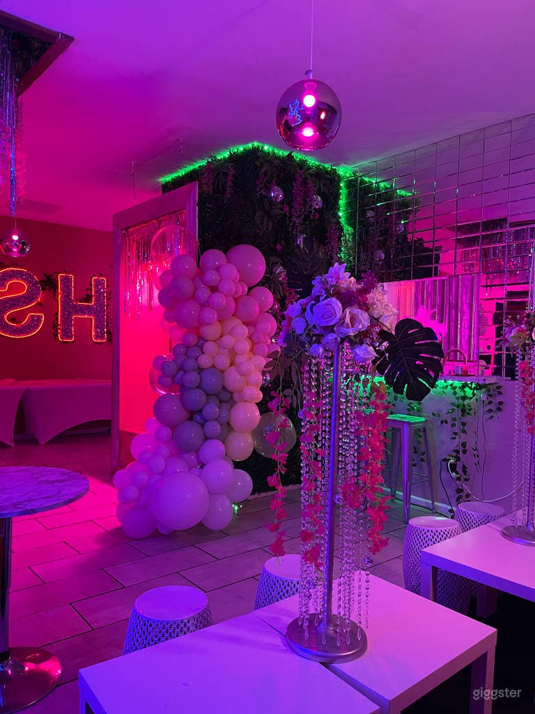  Customized balloon garland around photo booth available as an add-on to elevate your event photos at Hush Events 