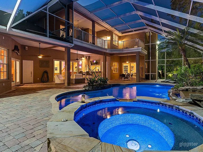 Tropical Screened Pool Estate w Waterfall Spa & Lush Grounds Photo 1