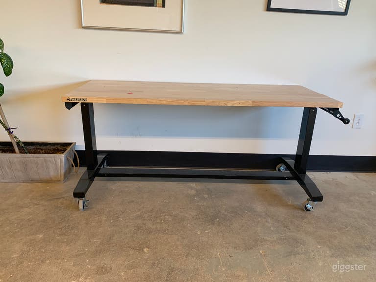  Five adjustable height workbenches + 15 studio stools 
