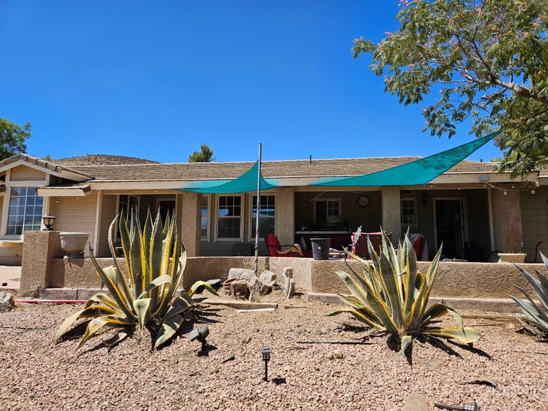 Ranch home on 5 acre horse farm with pool and outbuildings. 