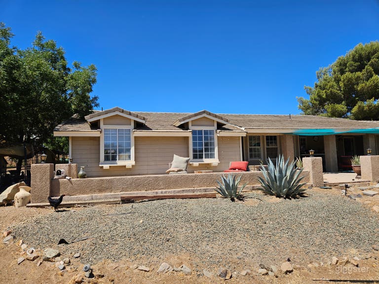  Ranch home on 5 acre horse farm with pool and outbuildings. 