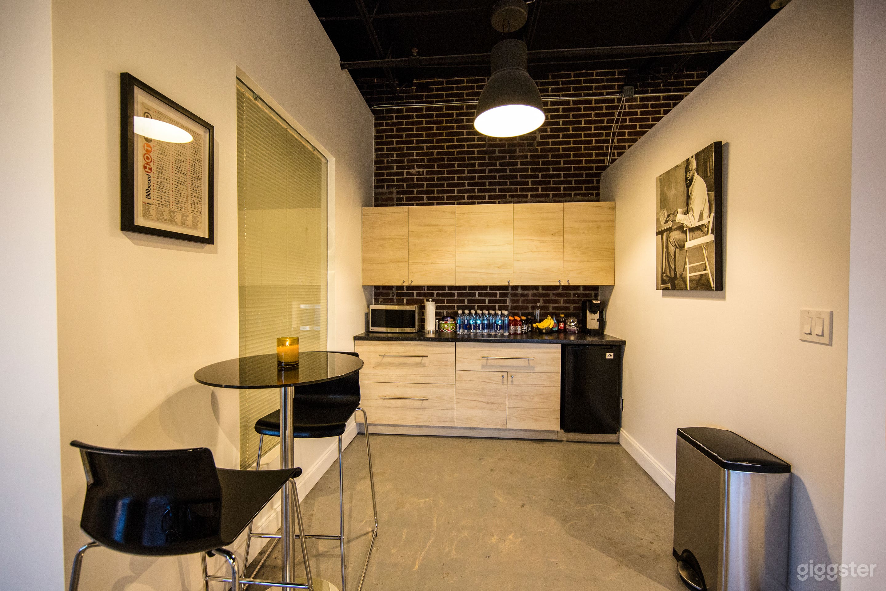 Kitchenette Area With Microwave and Mini Fridge.