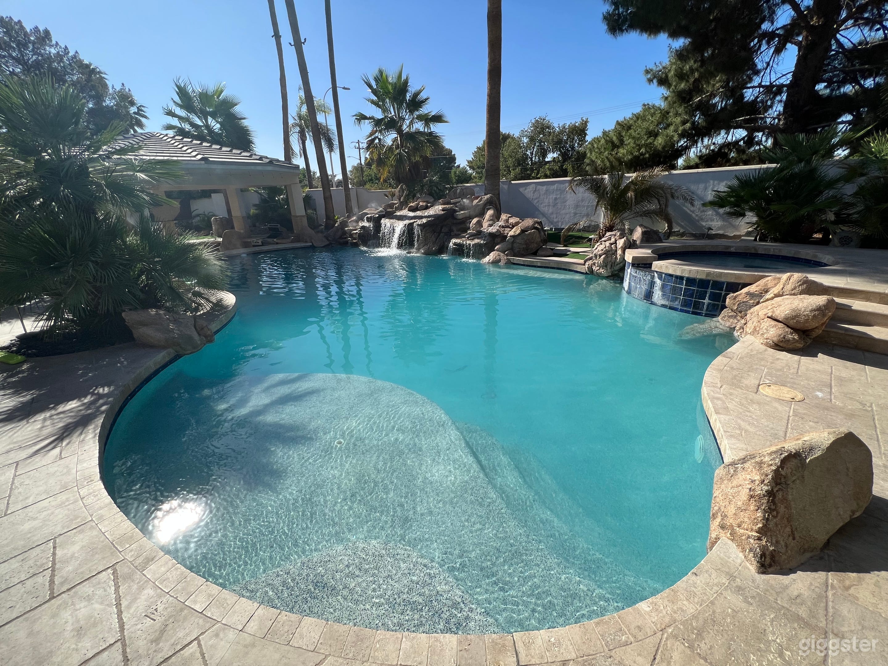 Resort style yard with two swimming pools, Fire pit , giant 6'5 Buddha, Artificial turf, mist system and gazebo. Excellent location for any photo shoot and production