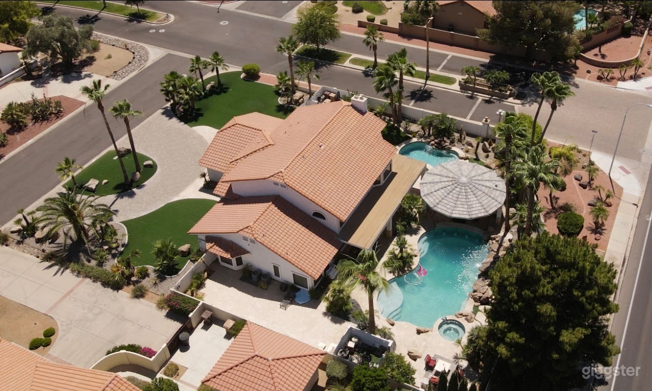 Resort style yard with two swimming pools, Fire pit , giant 6'5 Buddha, Artificial turf, mist system and gazebo. Excellent location for any photo shoot and production