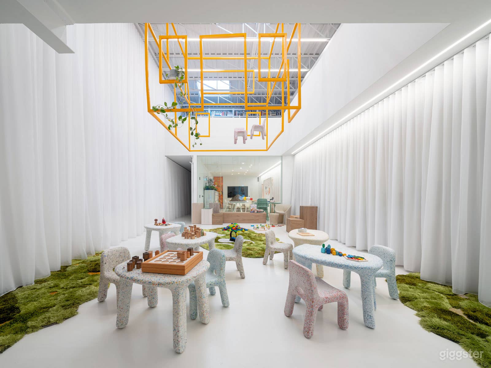 Double height atrium space.  Photo shows a temporary setup for a children’s event.