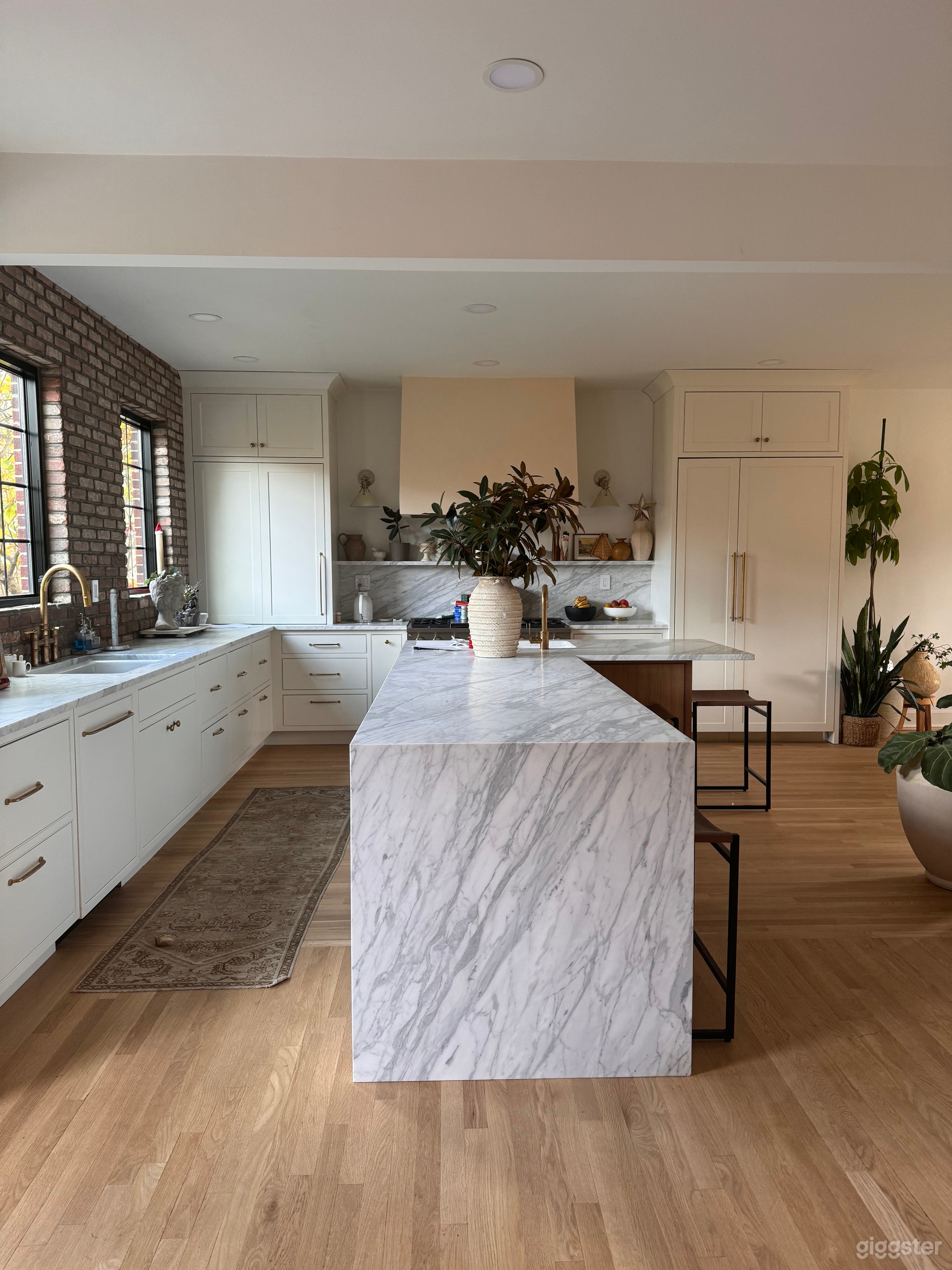 Kitchen with marble counters, custom cabinetry 