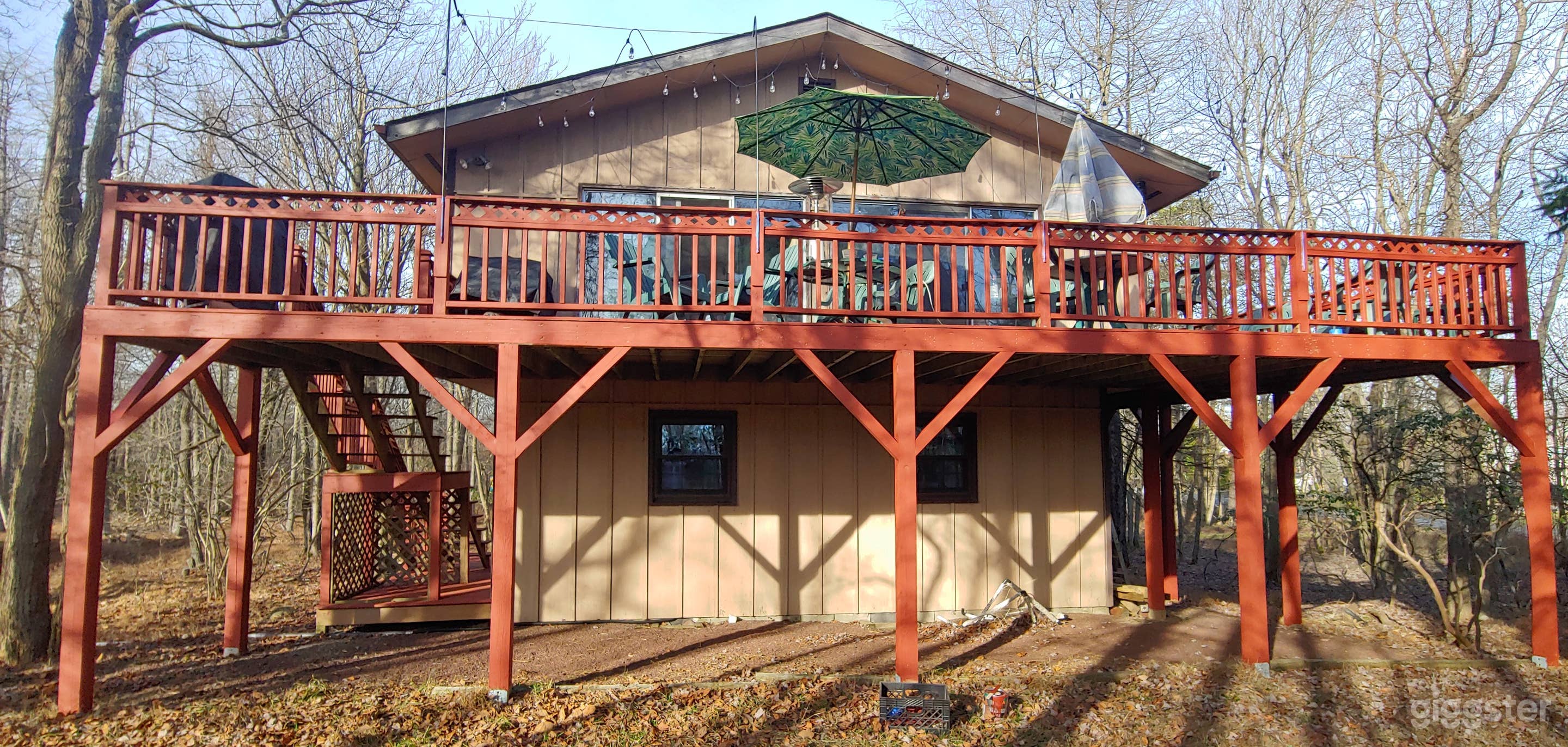 Front of House. Large wrap around deck. From front yard. 