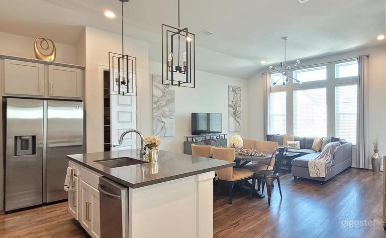  High ceilings and large windows providing abundant natural light 