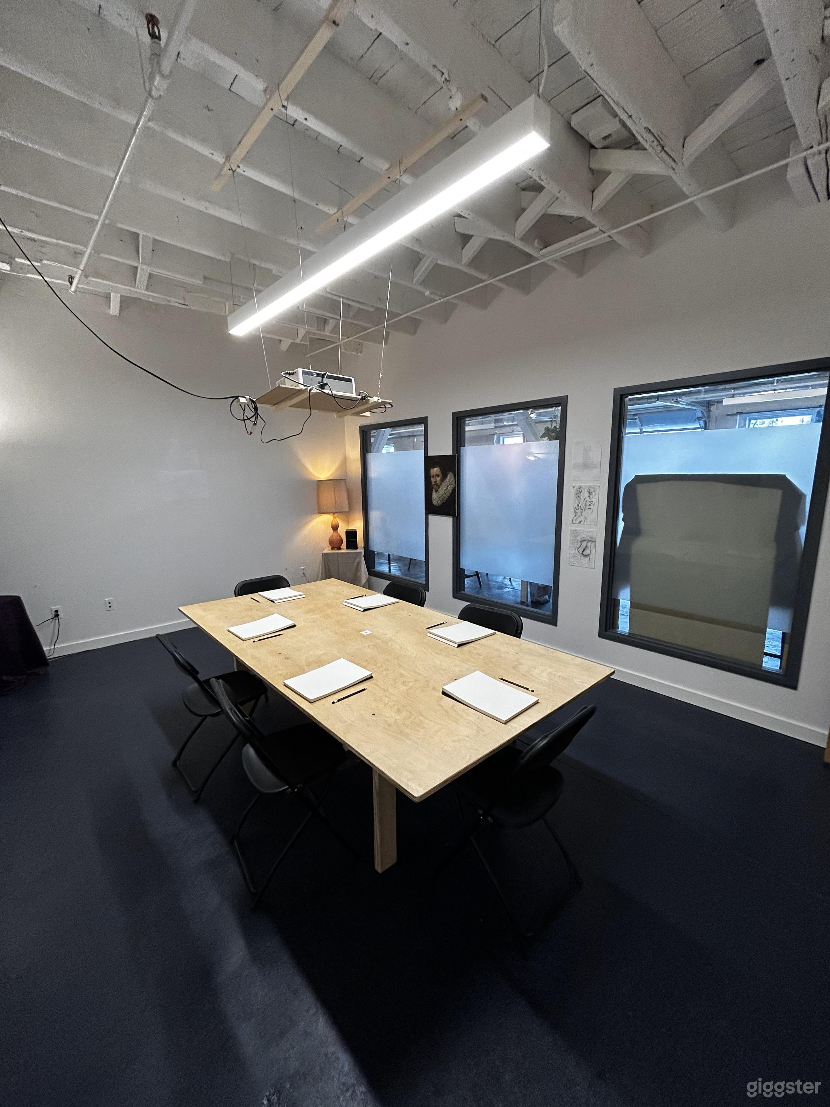 Large windows allow light in! Don't get stuck in a bunker of a conference room - see the light of day! 
Windows can be blacked out for photo/projection use. 