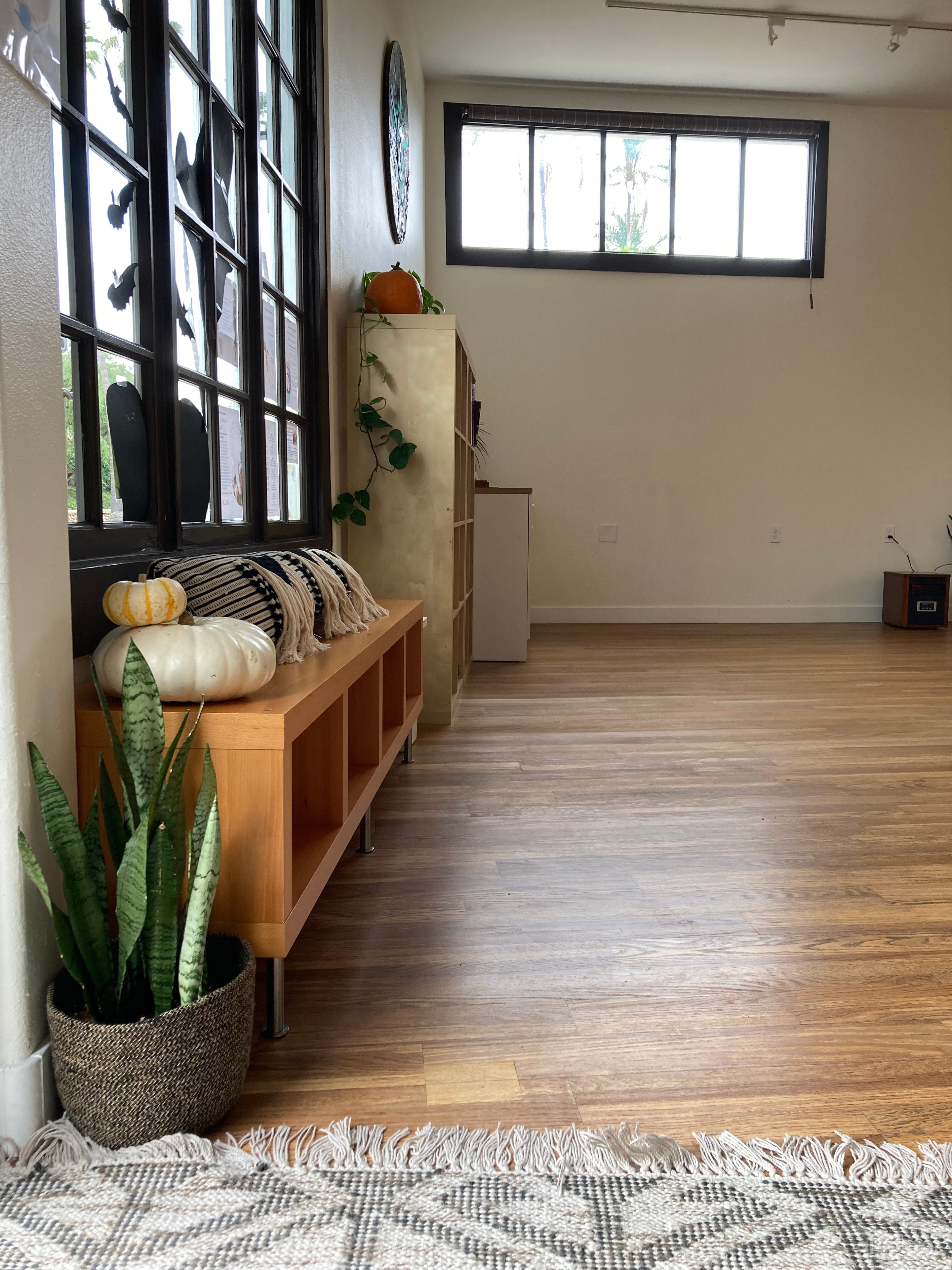 Entryway with open cubbies, large windows. Not pictured: private bathroom/changing room.