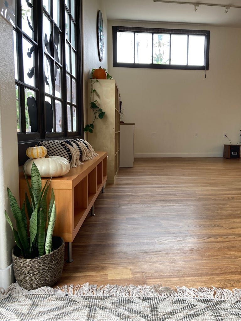  Entryway with open cubbies, large windows. Not pictured: private bathroom/changing room. 