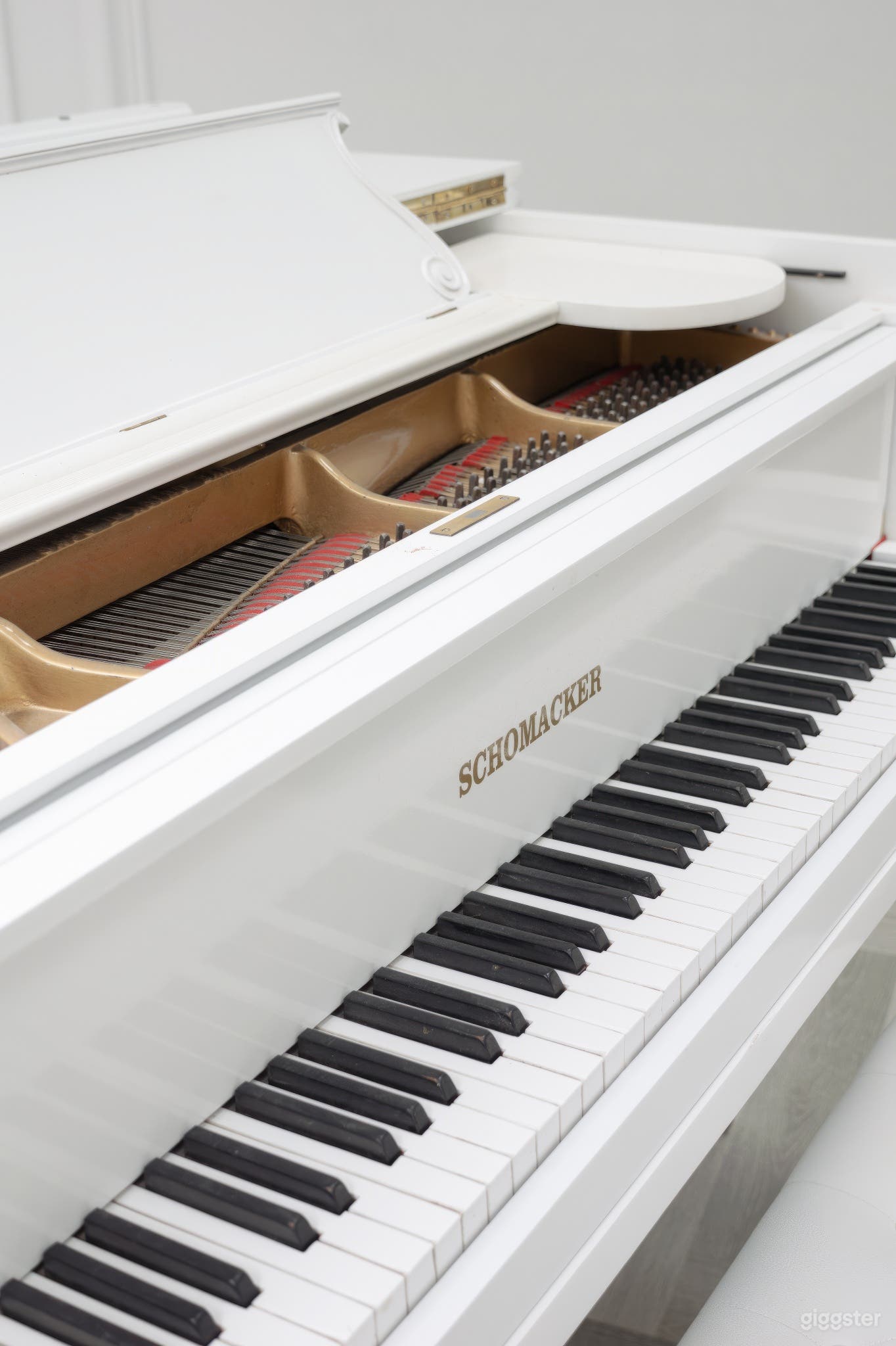 Stunning grand white piano, centerpiece of elegance and sophistication