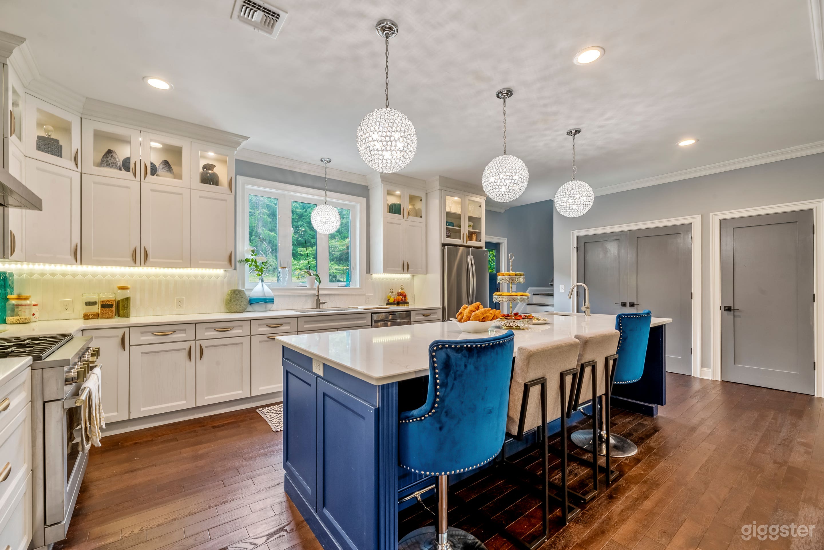 large kitchen with white and blue