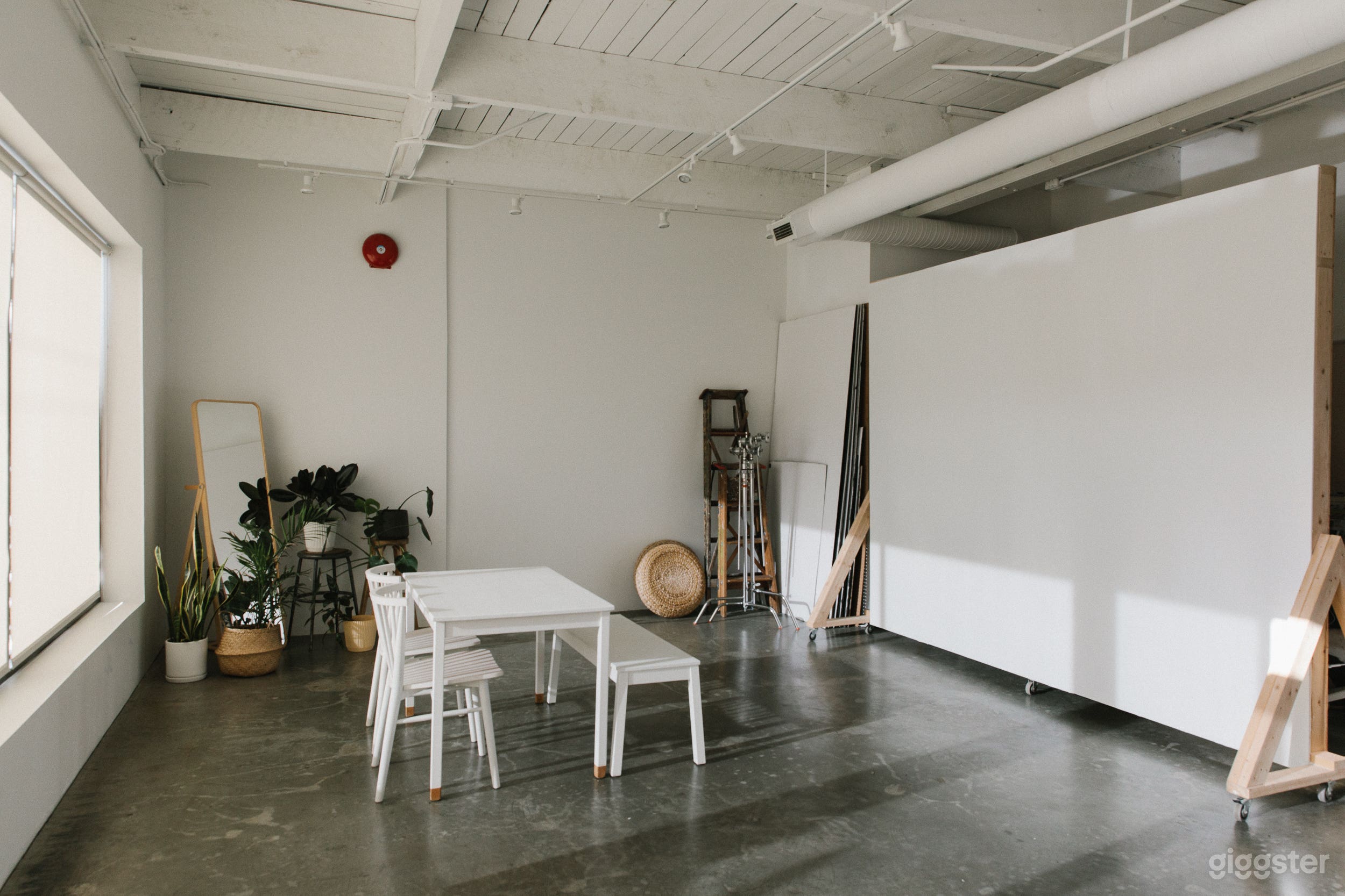 Main studio space. South facing windows, movable backdrop wall, lots of furniture options.