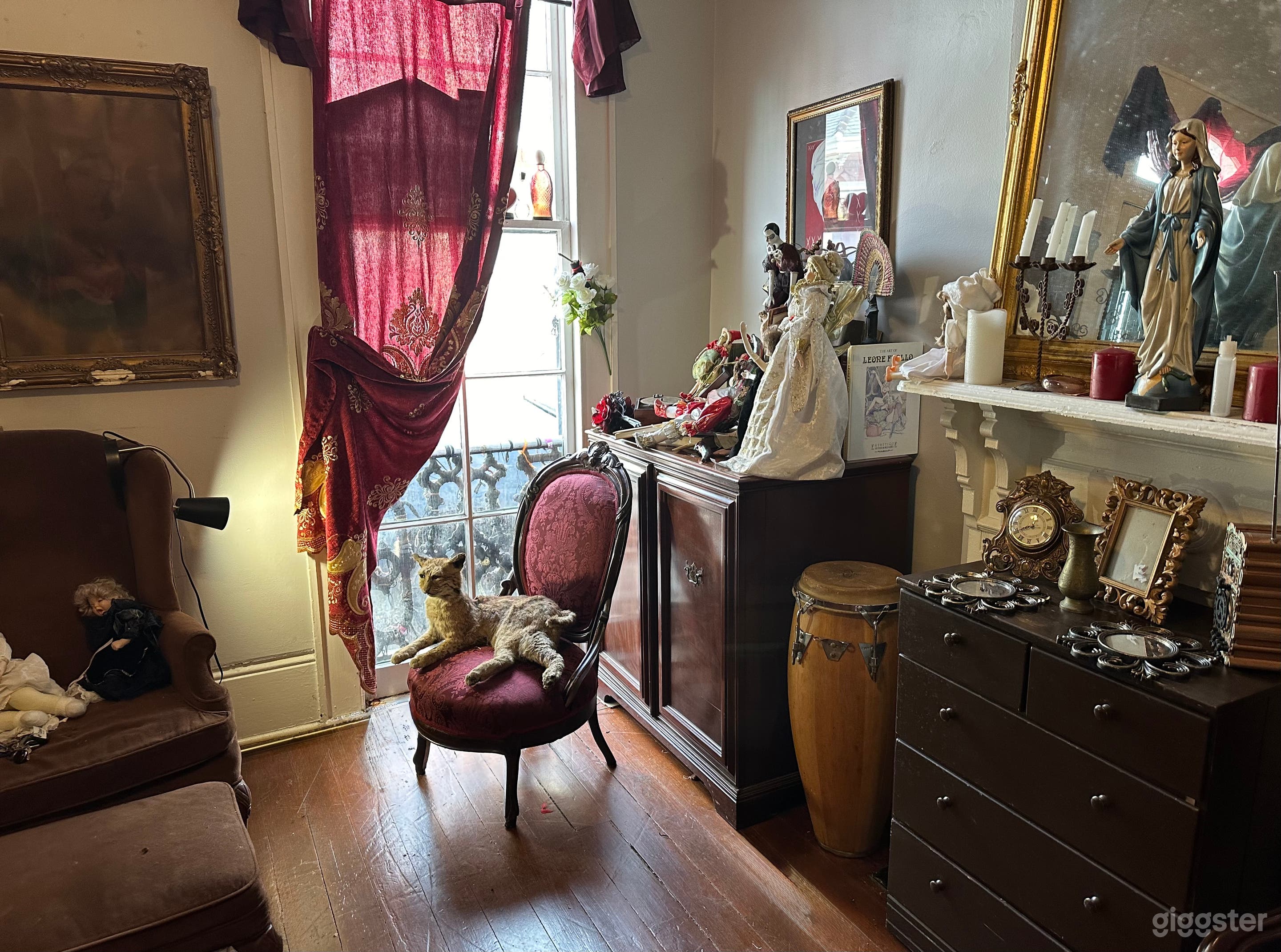 You see Wilbur the cat proudly guards the window and the Virgin Mary in center of the altar is a New Orleans Voodoo way to honor w candles and few other devotions there and in window. We moved the victorian privacy screen and brought Wilbur in the light