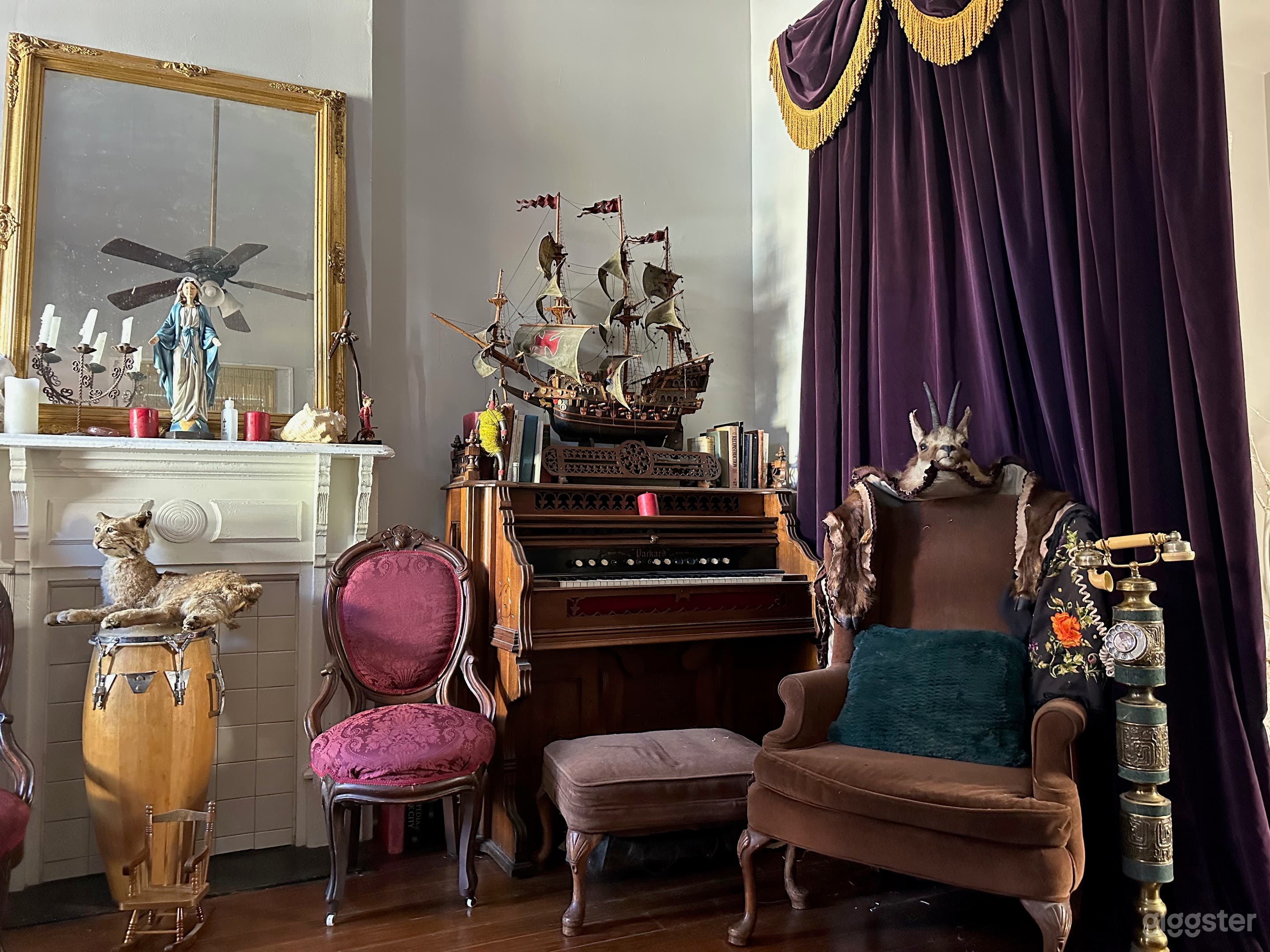 Enter my full victorian voodoo aesthetic parlor. This is both a great mood setter and Historic. It is dedicated to Voodoo queen Marie Laveau who was born on this property. Altar pieces  &amp; Mountain lion Wilbur, should stay as is but  to move furniture is ok