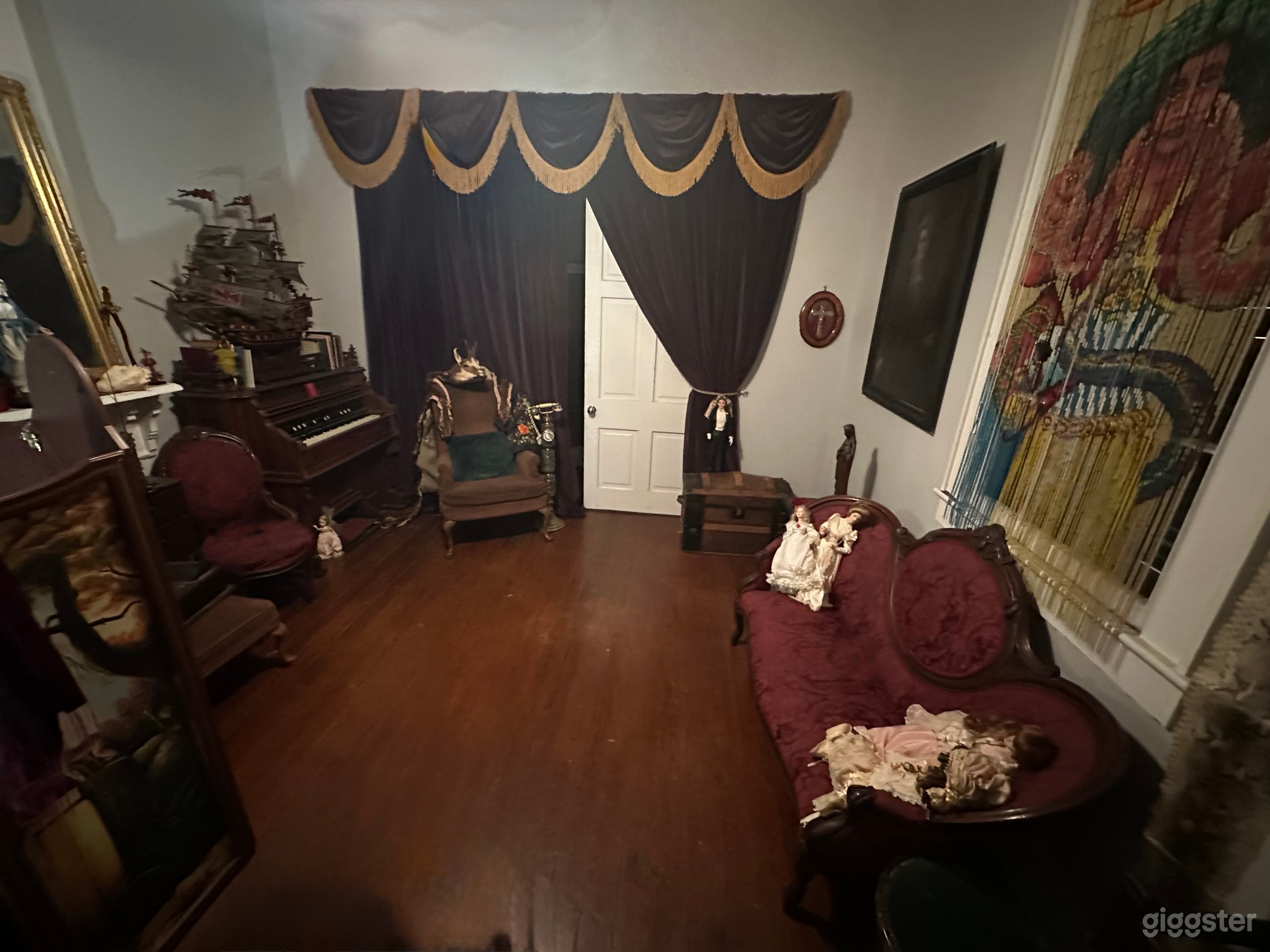 Swag to the righ.t
 swag to the left ...
Historic sliding Pocket doors with full purple velvet theatre curtain drapes. to enter into the  Mystic chamber