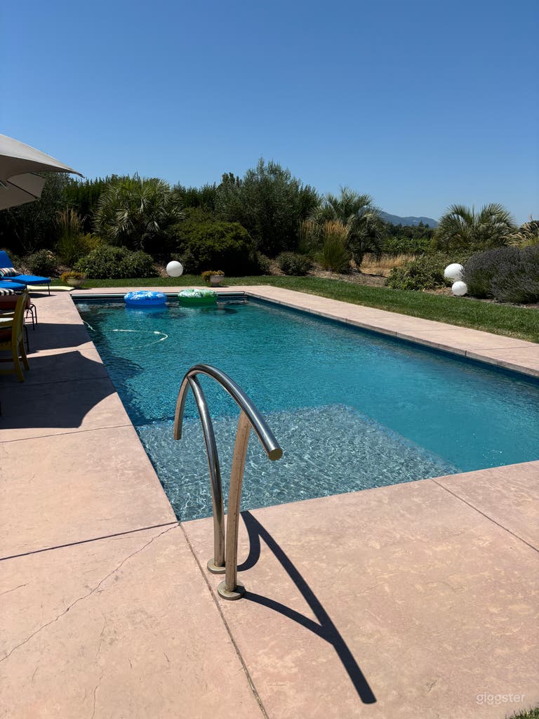  Solar/thermal heated pool with lush landscaping makes for a inviting photo shoot or filming. 