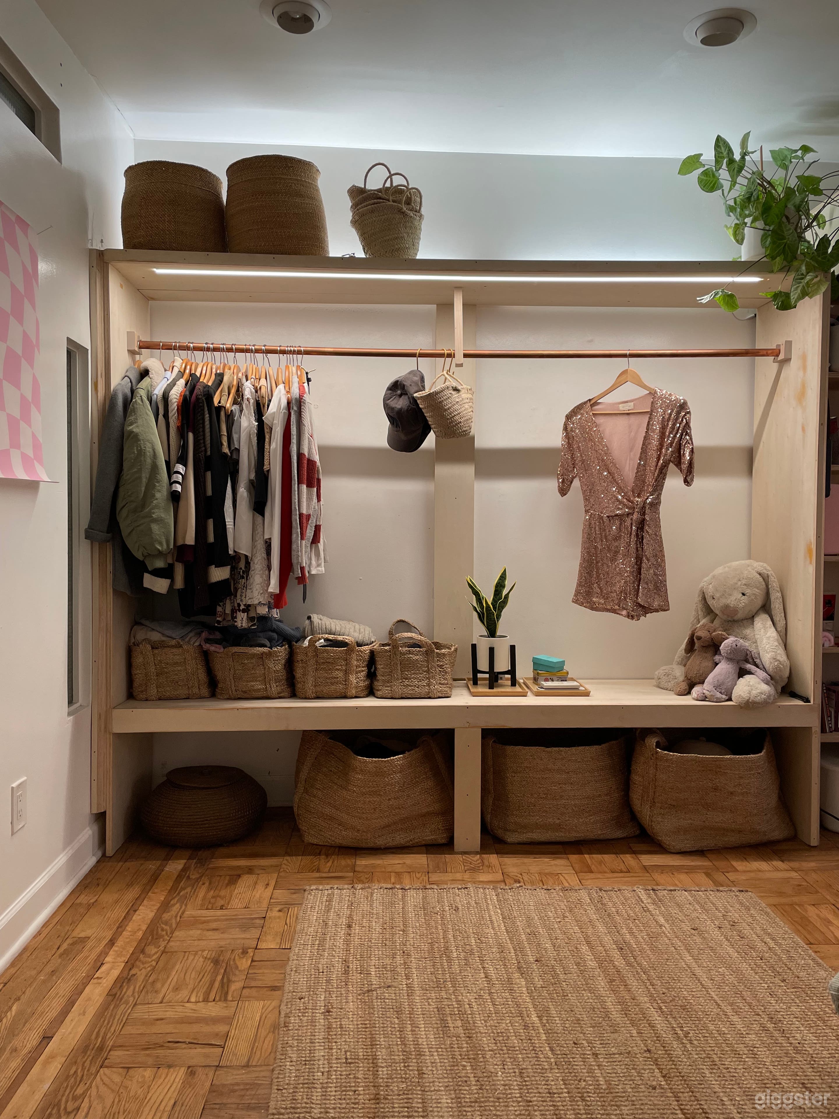 Custom wardrobe space with LED lighting in downstairs bedroom