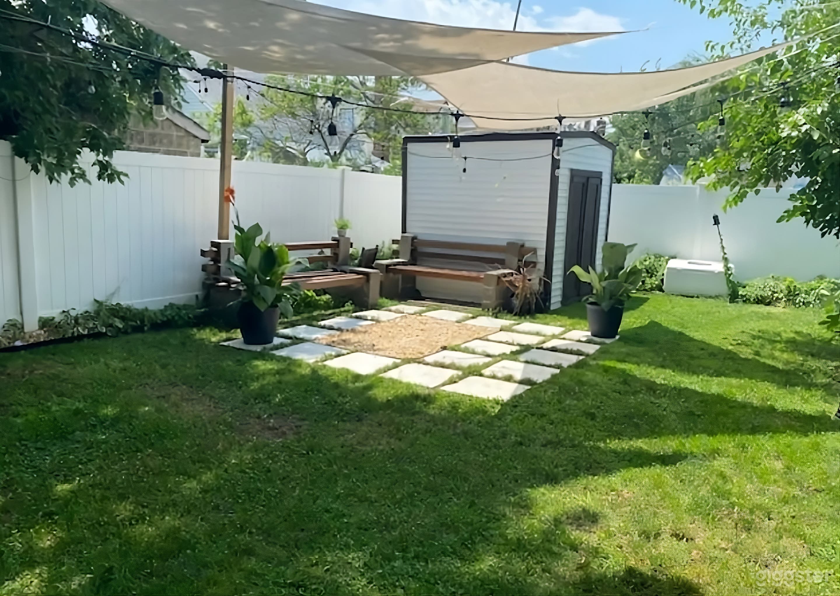 Cozy Fenced Lush Backyard Photo 3