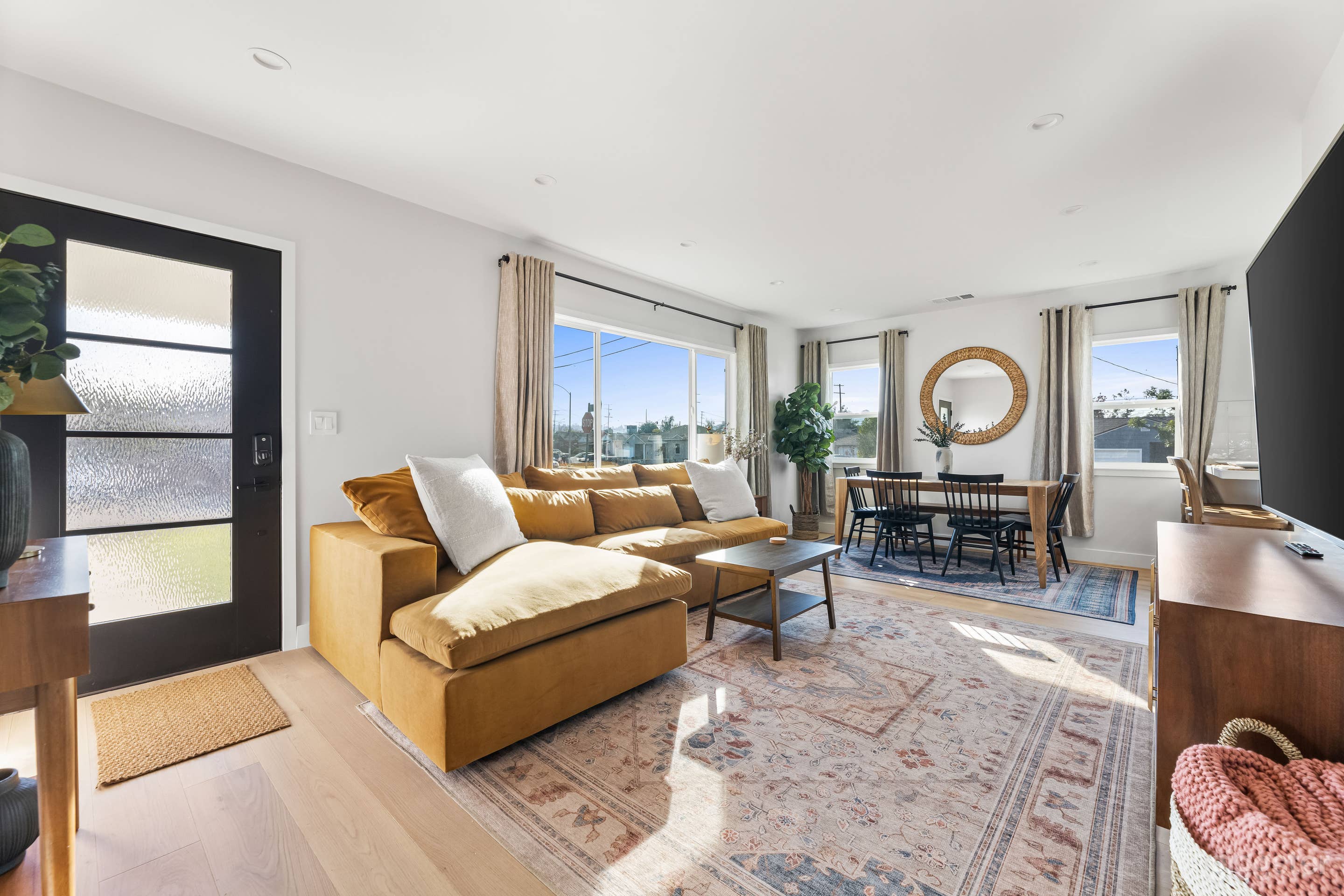 Open concept livingroom with mid-century furnishings- mostly West Elm. 