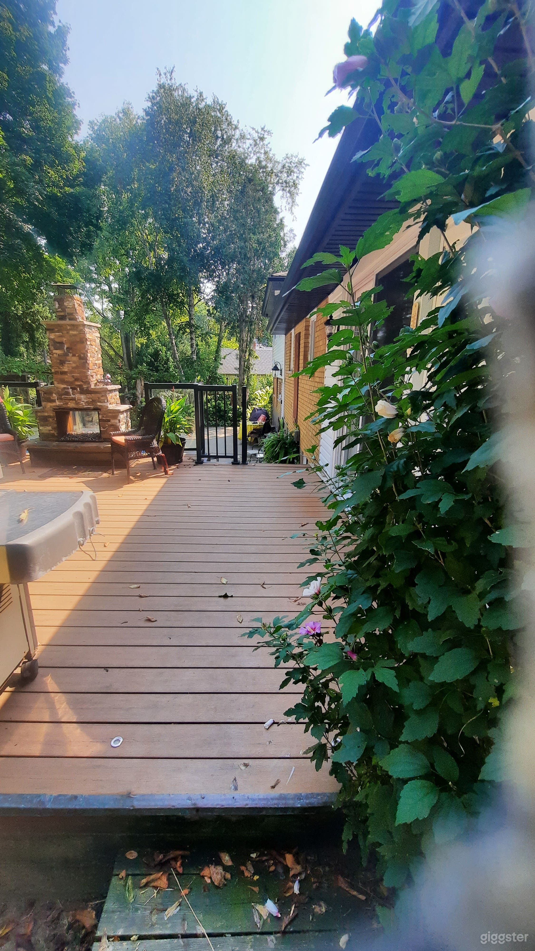 Custom gas fireplace on upper two-level deck.