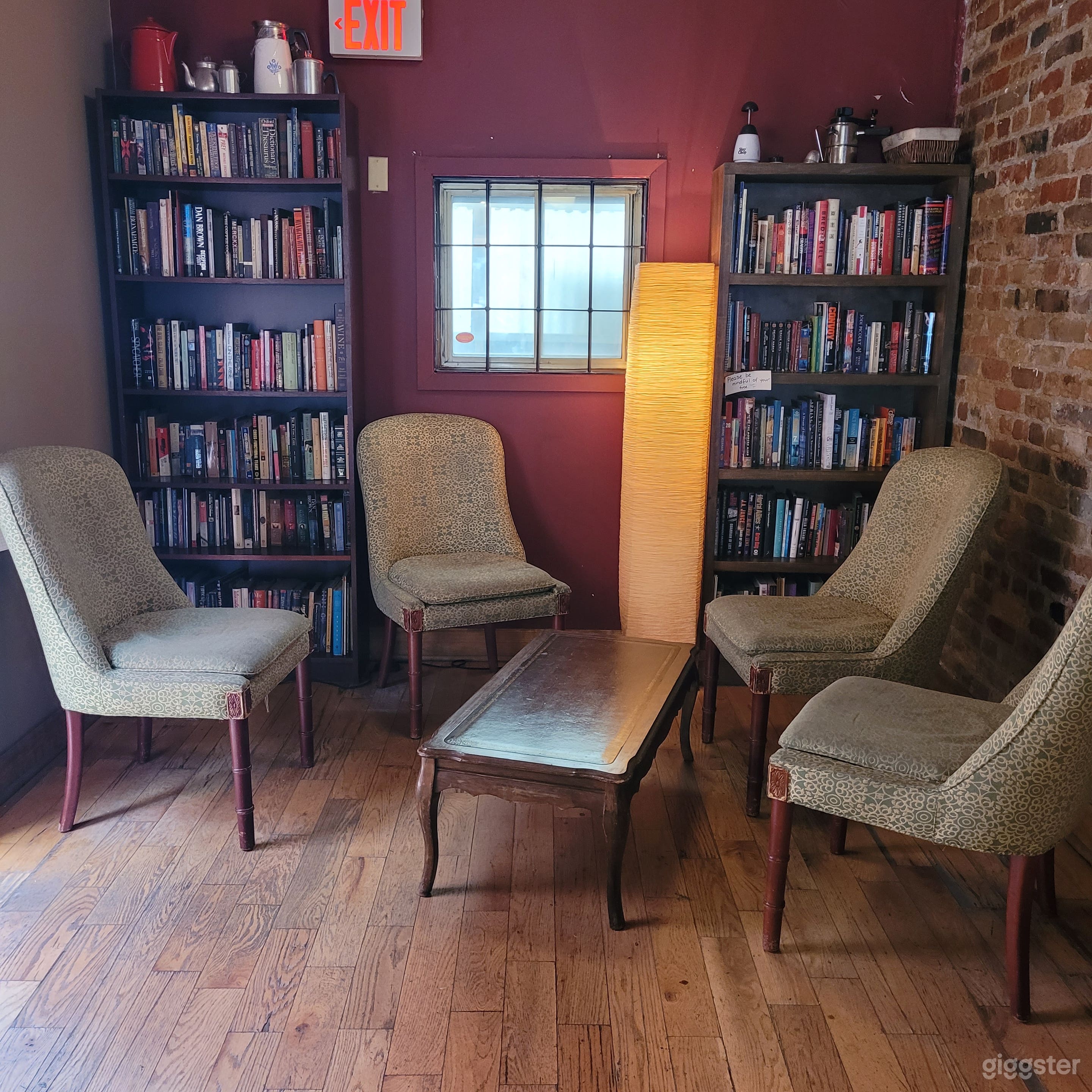 The reason for all of the bookshelves is that we have a leave-one-take-one book program. It also just makes the space feel that much warmer.
