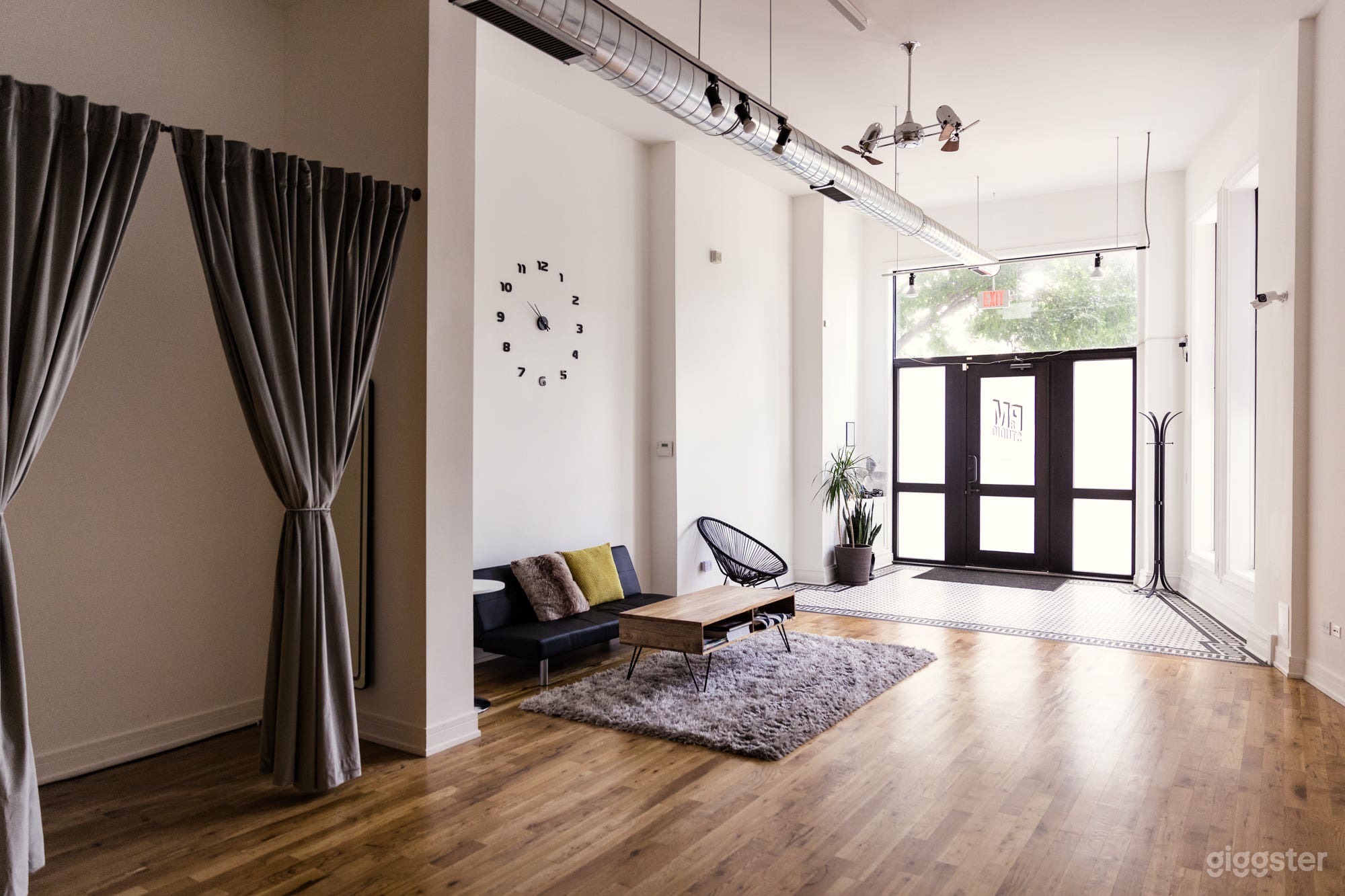 Natural light photography studio with dressing room and lounge area