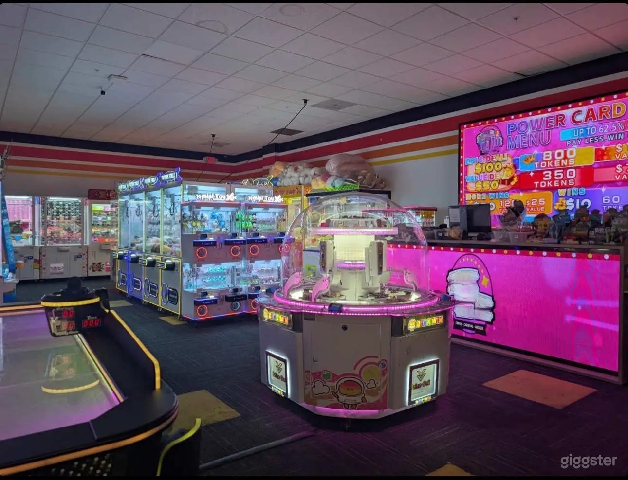 Vibrant Arcade with Neon Lights & Classic Games Photo 2