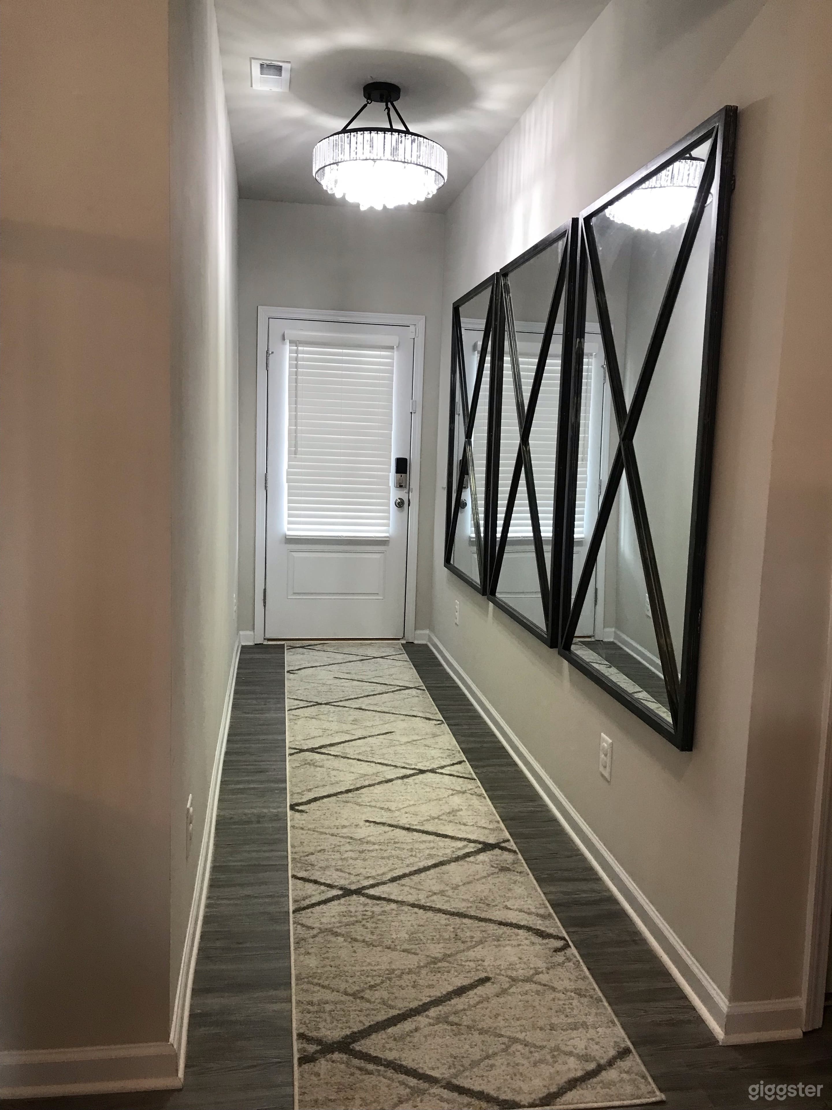 Front door and entryway w/chandelier, new rug and beautiful mirrors