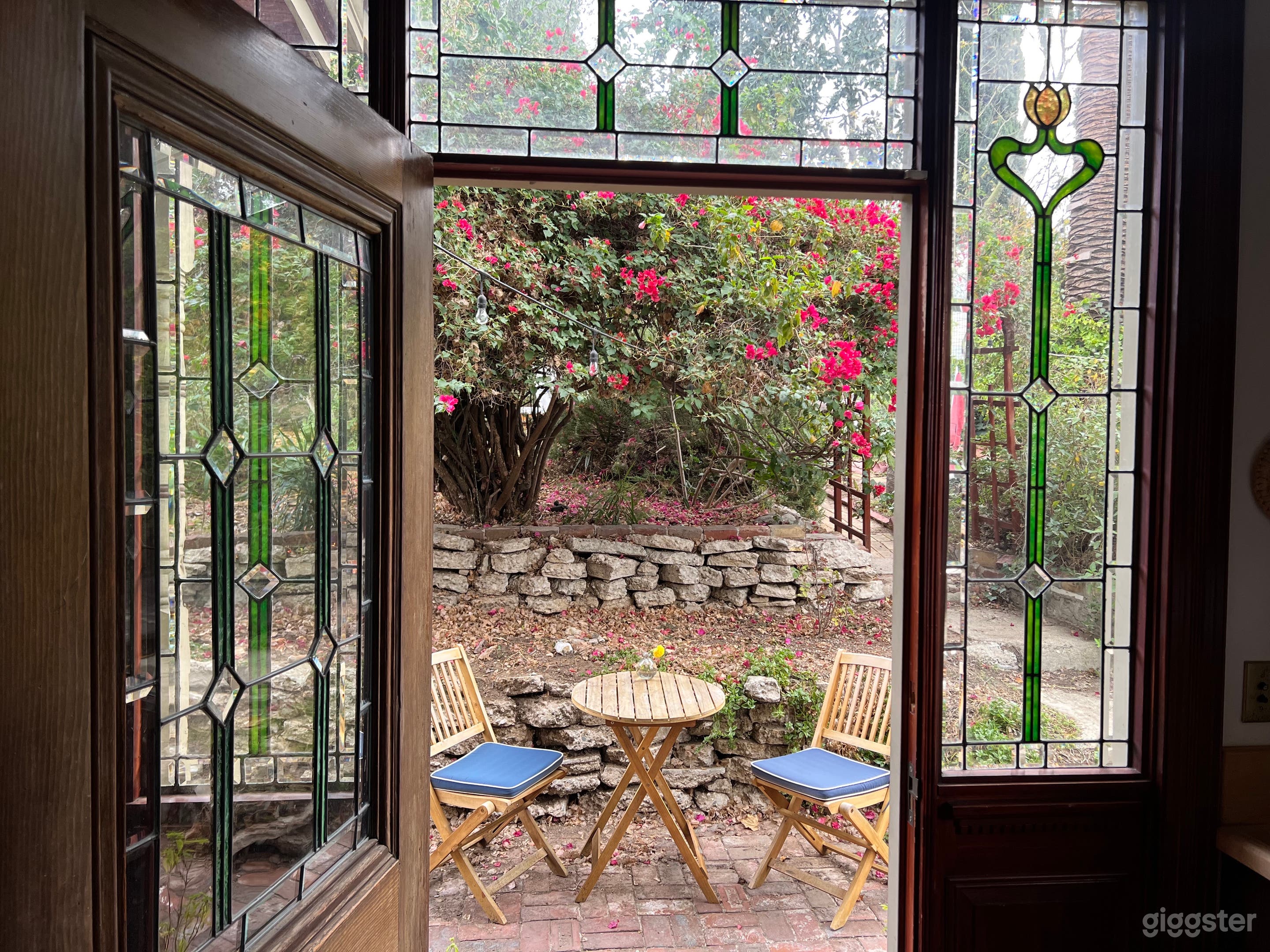 Stained glass kitchen window and backdoor that leads to the backyard