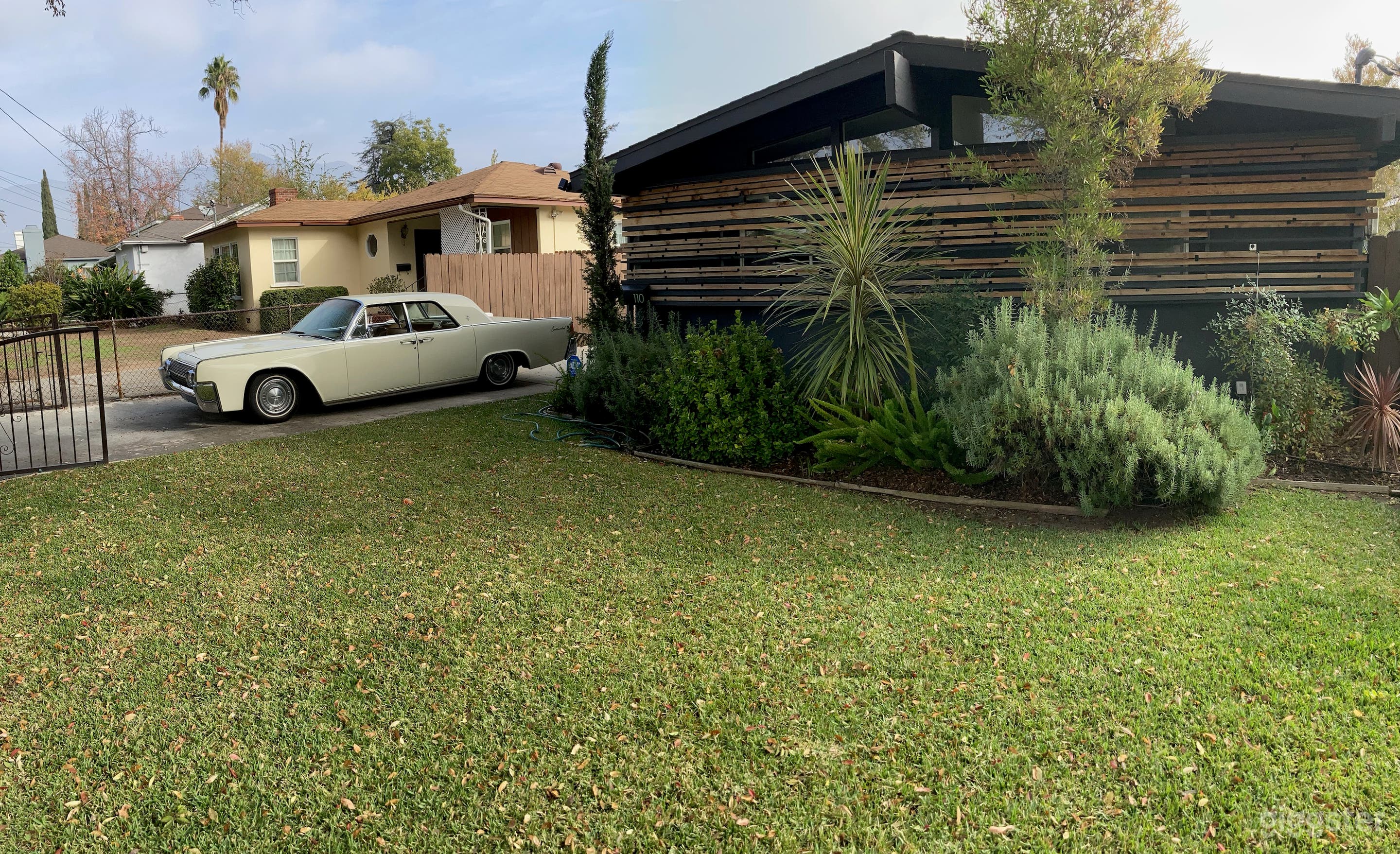 Front of the house w vintage Lincoln Continental 