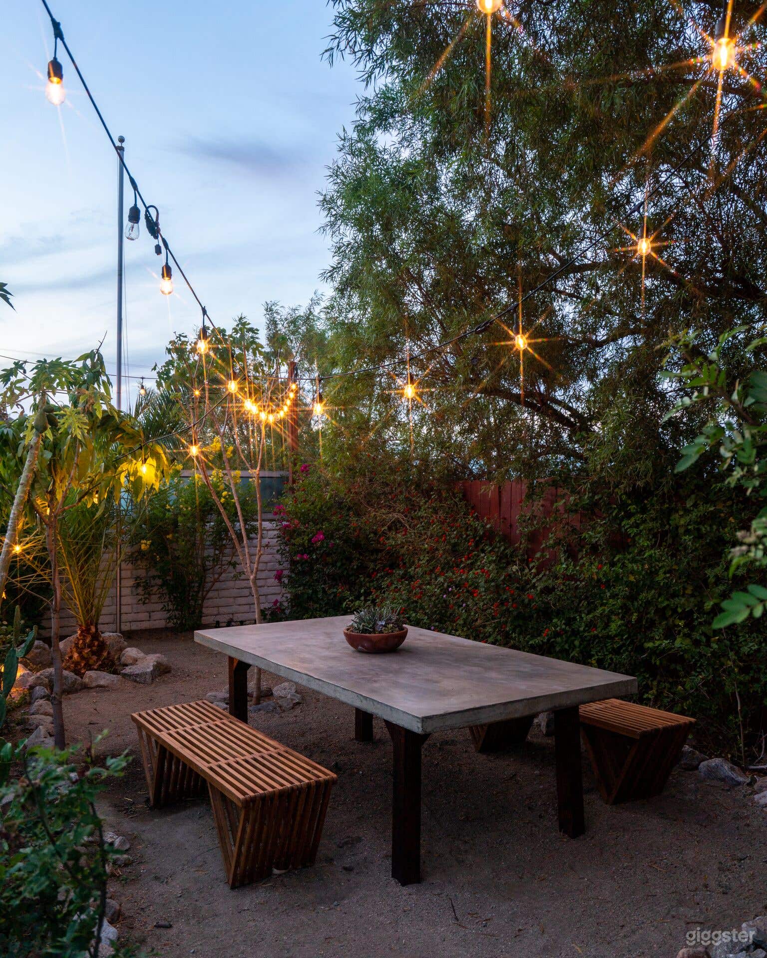 Outdoor dining table in a garden setting