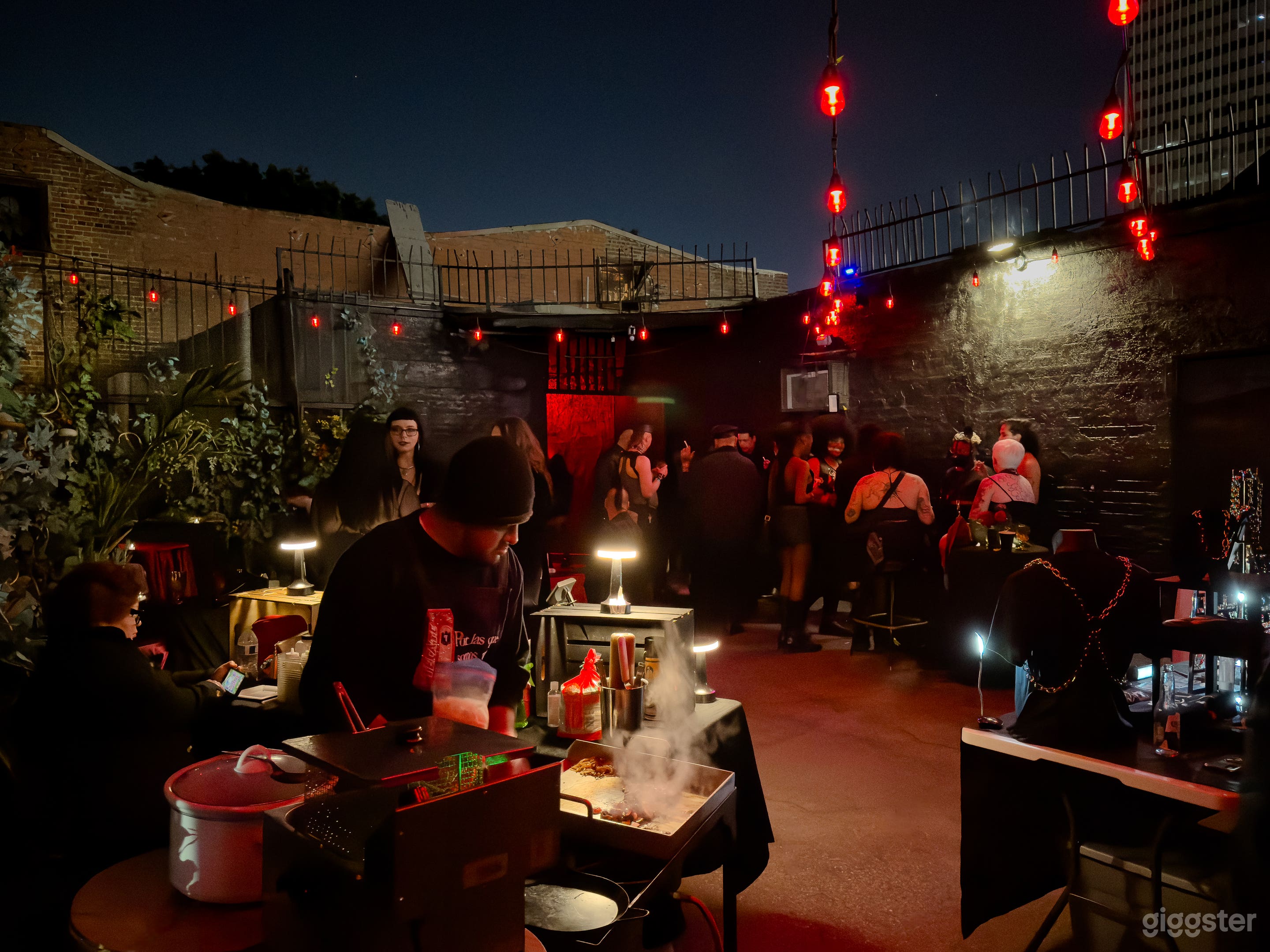 Our backyard area is equipped with string lights, and high tables and chairs. Smoking allowed.