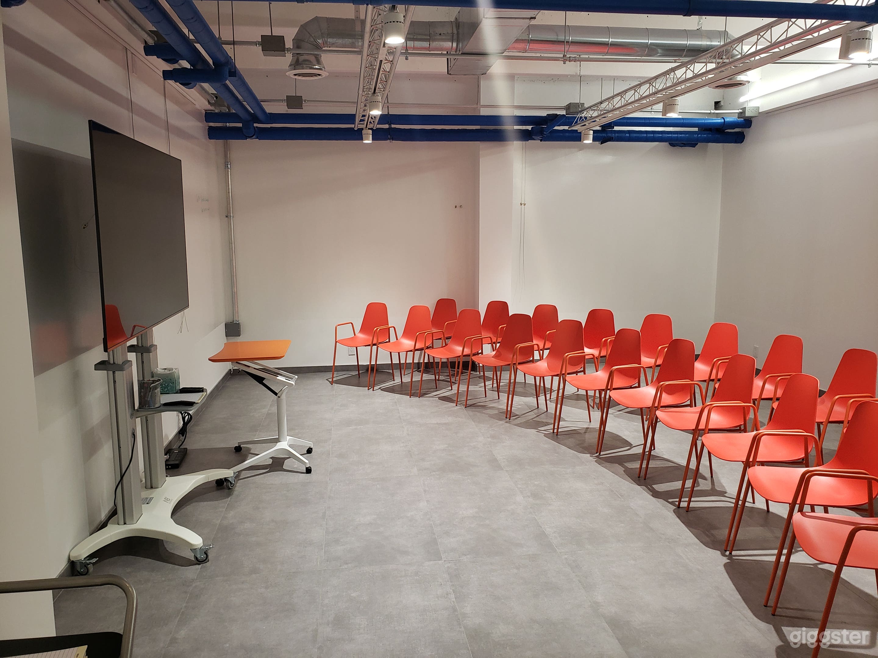 Flexible space - setup without tables. Large screen TV available to hook up with PC or Mac.