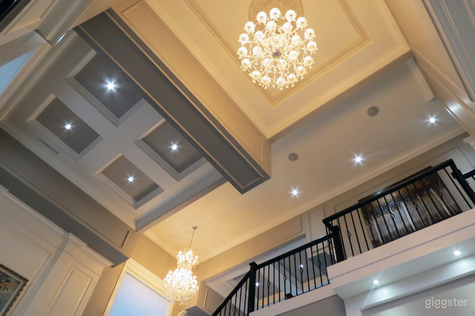 Decorative High Ceilings and Beautiful Chandeliers throughout the Entrance, Staircase and Dinning Room.