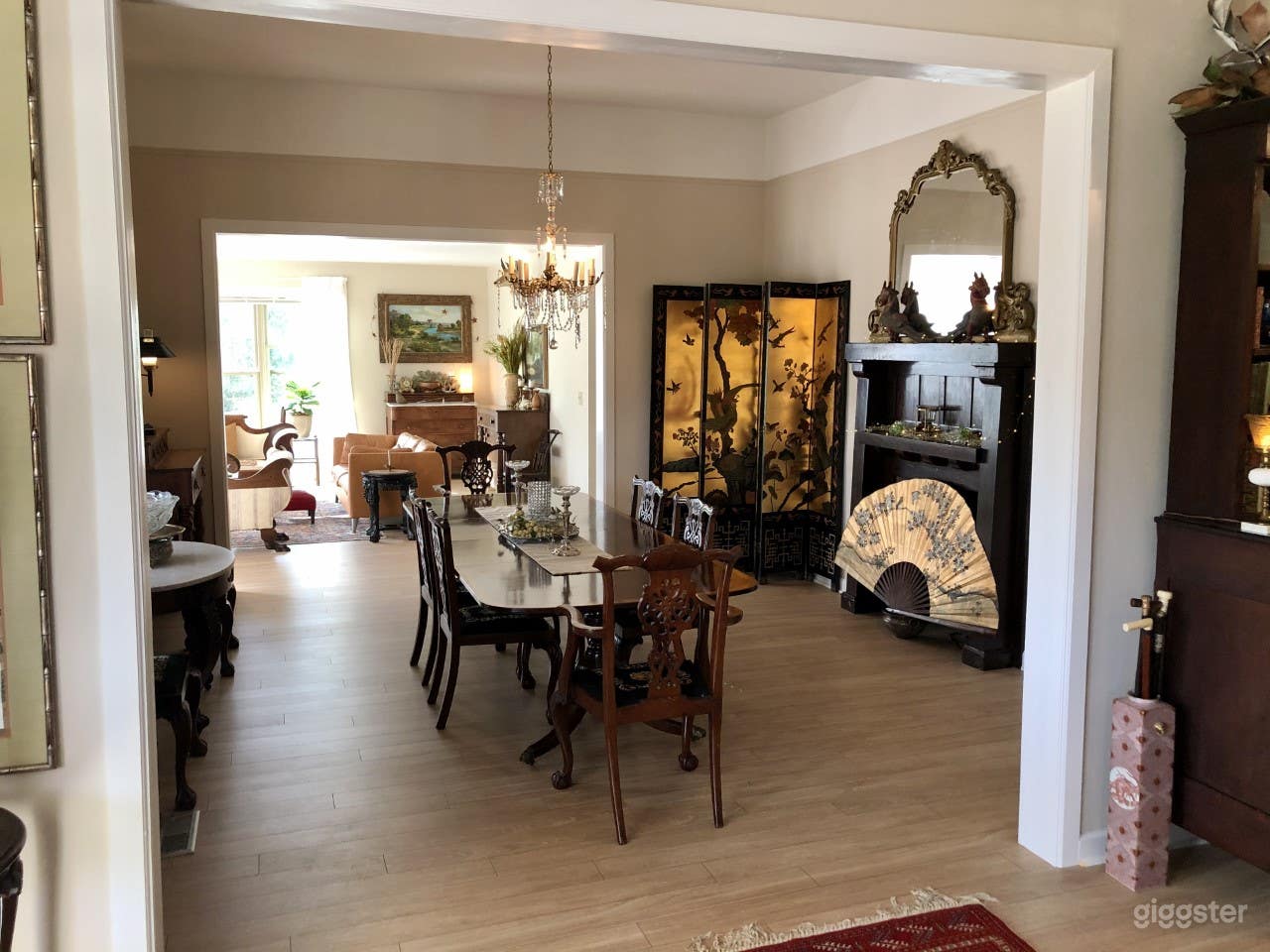 VIEW FROM FRONT DOOR ENTRANCE HALL ACROSS DINING ROOM TO SUN ROOM