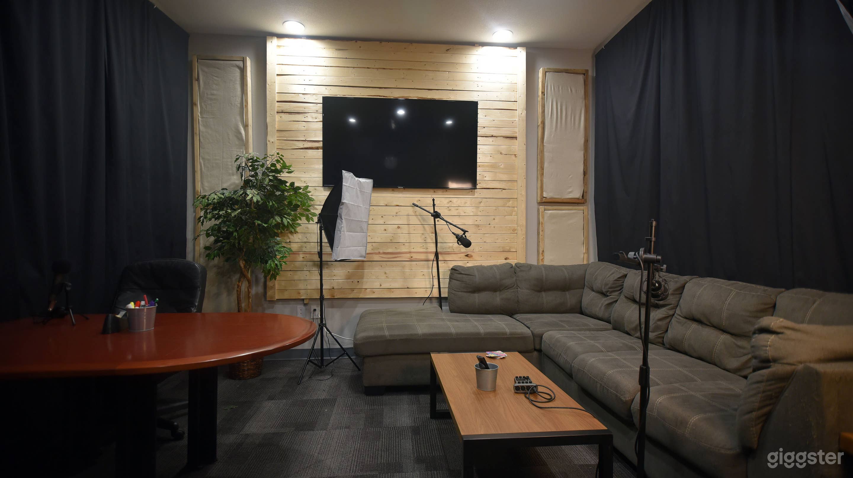 Large interview room, conference room, or livestreaming with guests. Includes lighting, mics, camera equipment, can be configured for your voice, your vision.