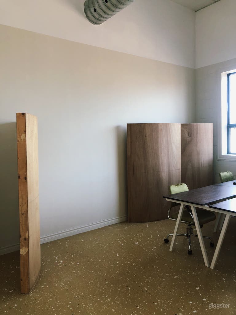  Open wall space along west wall. Mobile wood partitions can help divide the space as needed. 