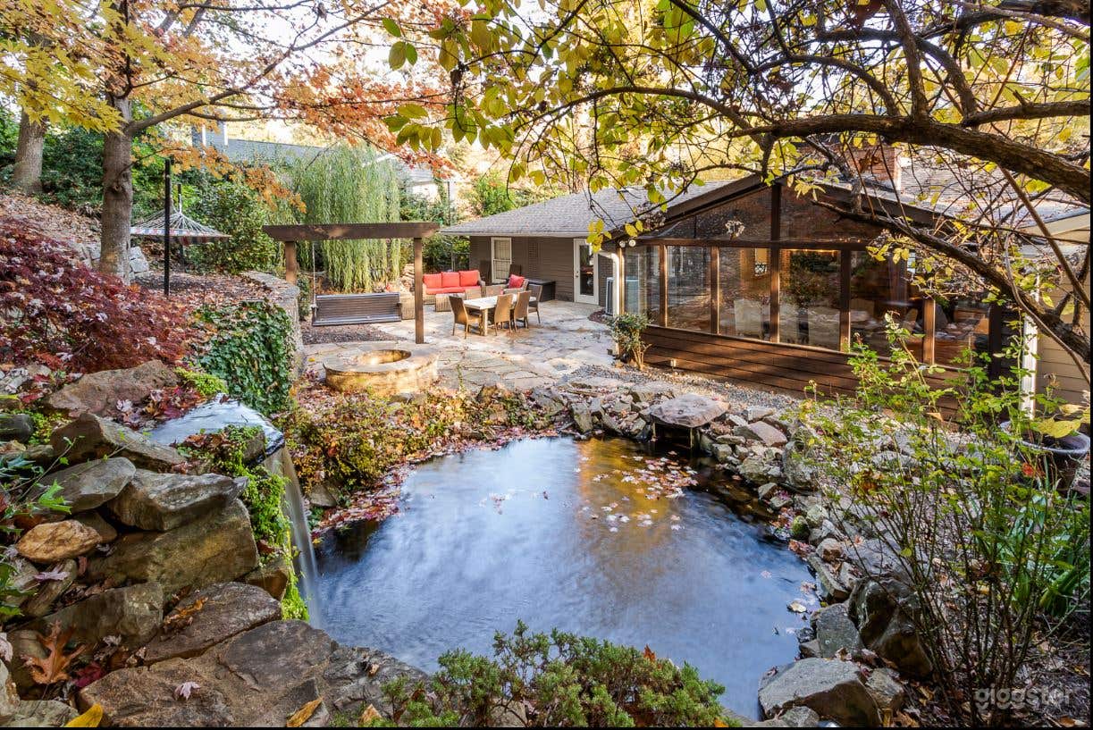 Backyard with firepit, waterfall and koi pond