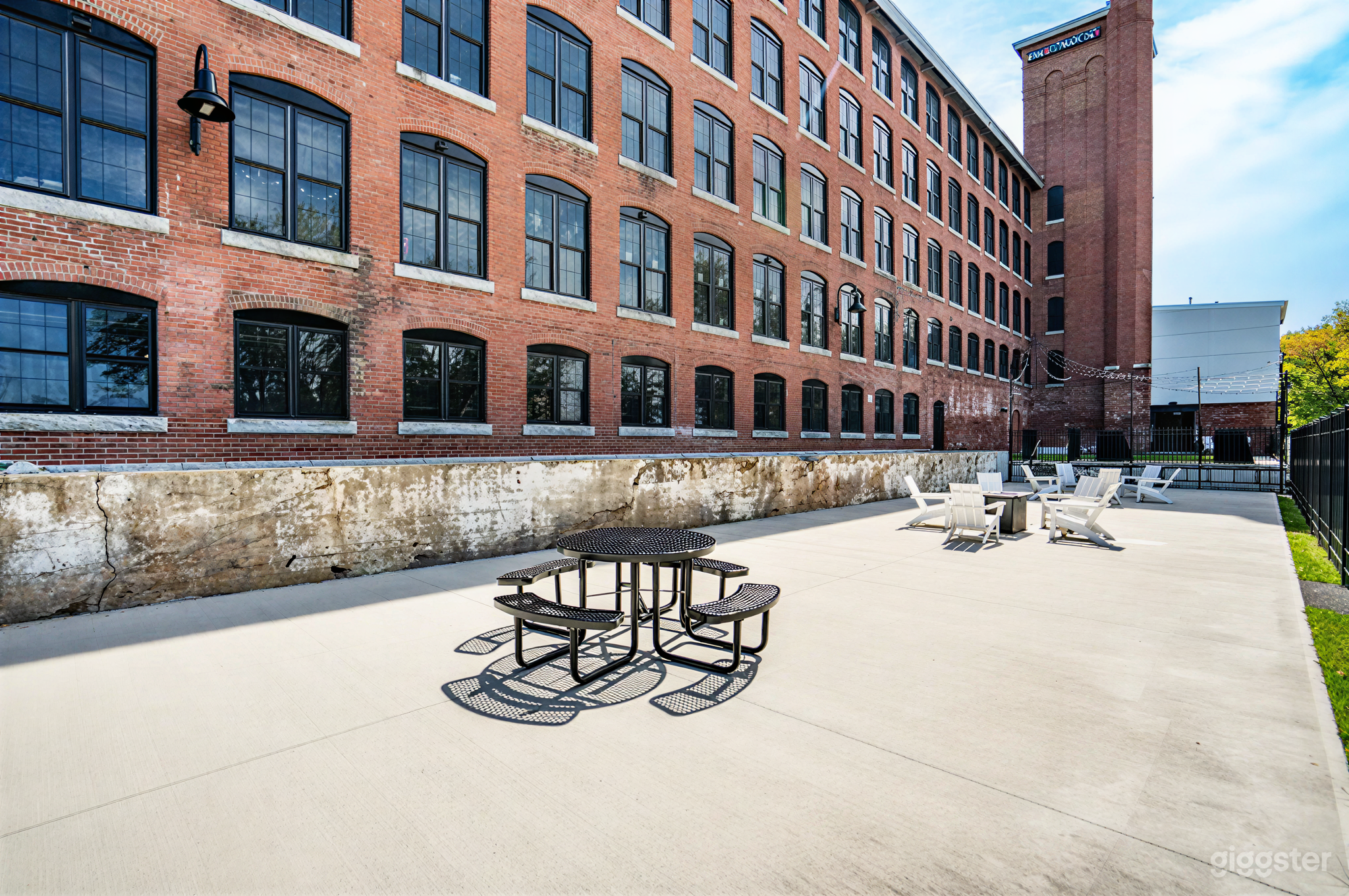Charming Lower Terrace with Red Brick & Bistro Lights Photo 1